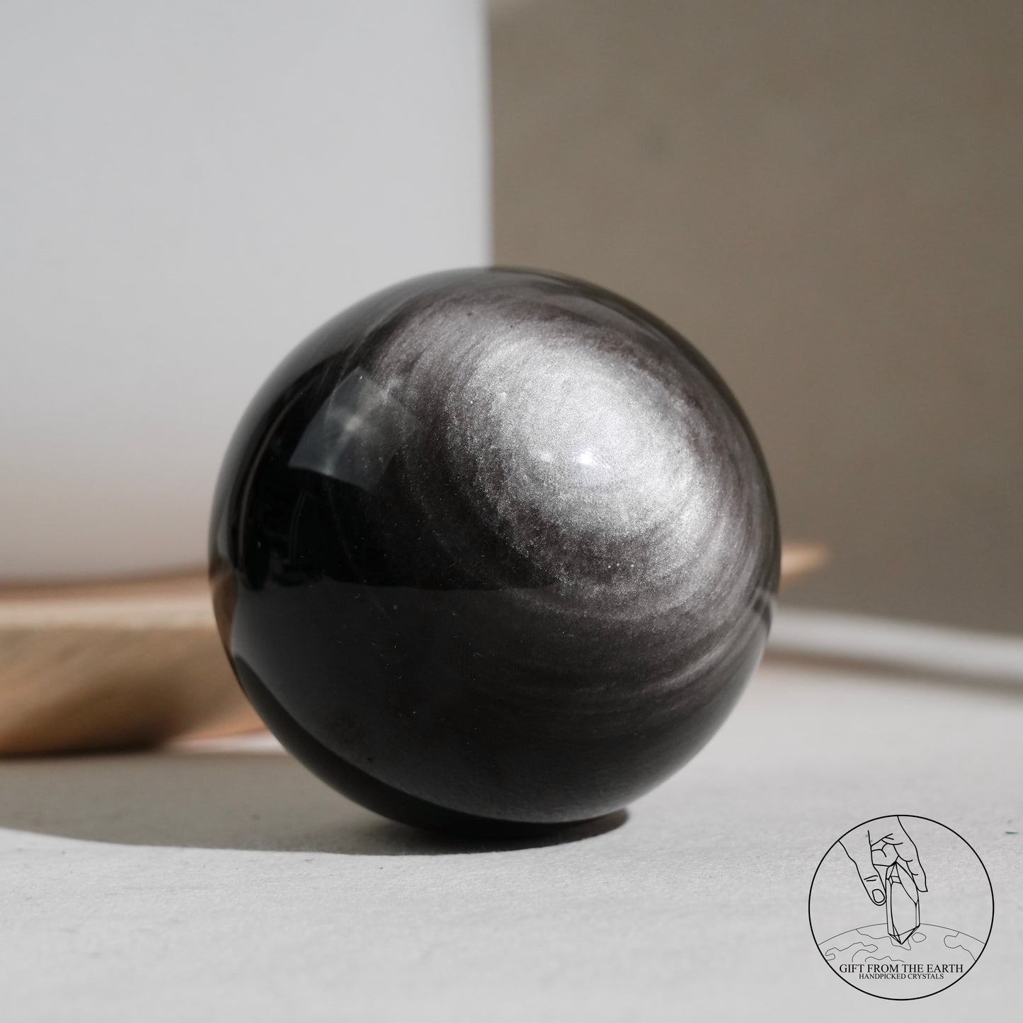 Silver sheen obsidian sphere