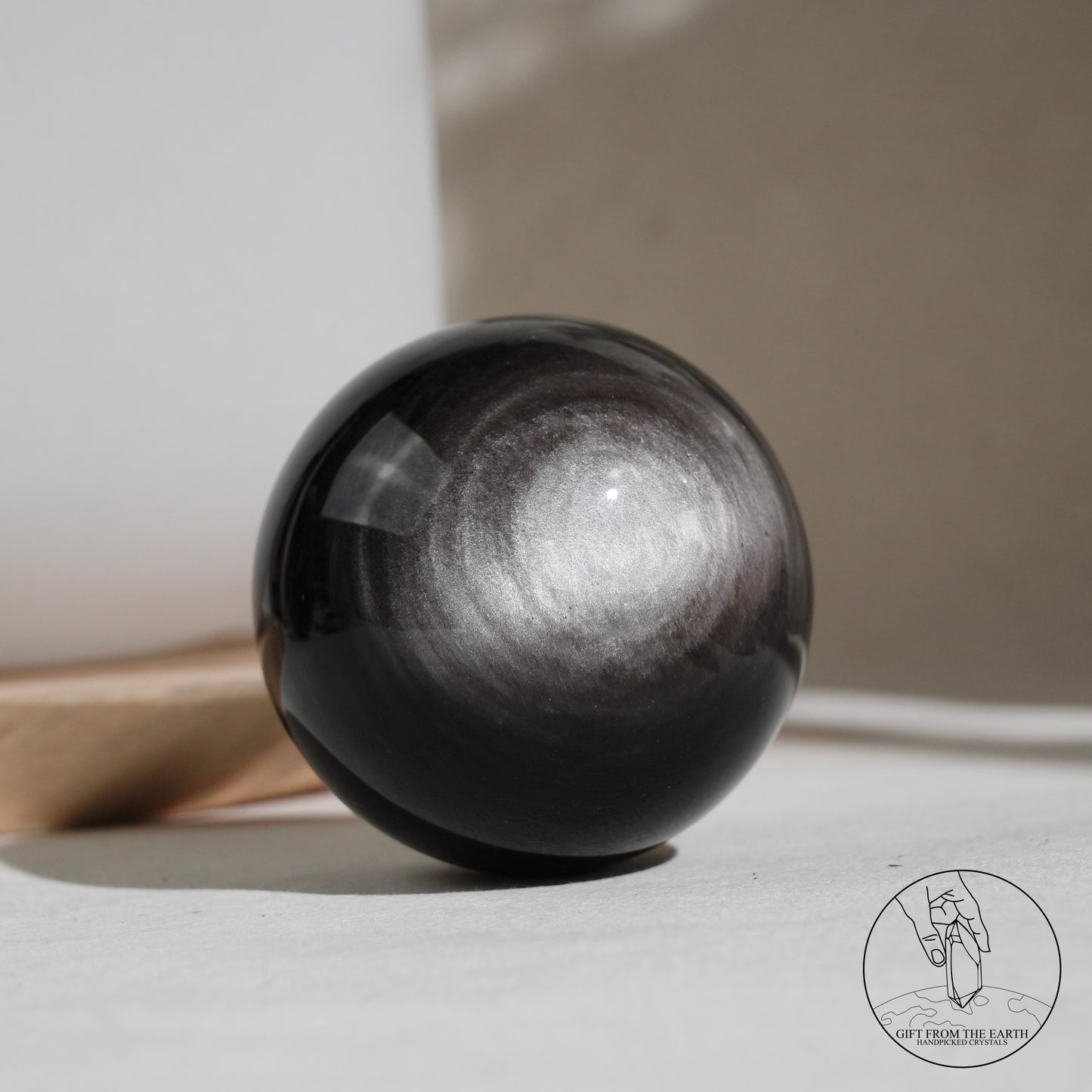 Silver sheen obsidian sphere