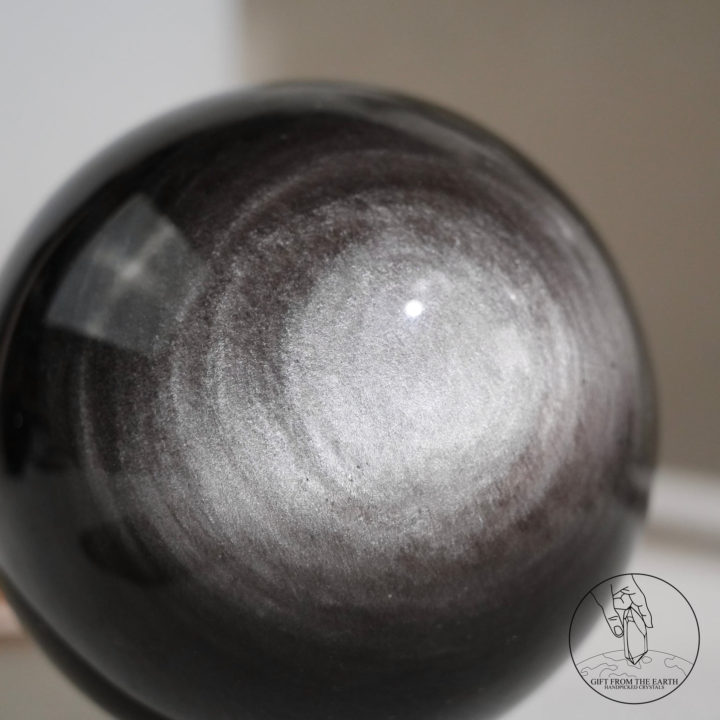 Silver sheen obsidian sphere