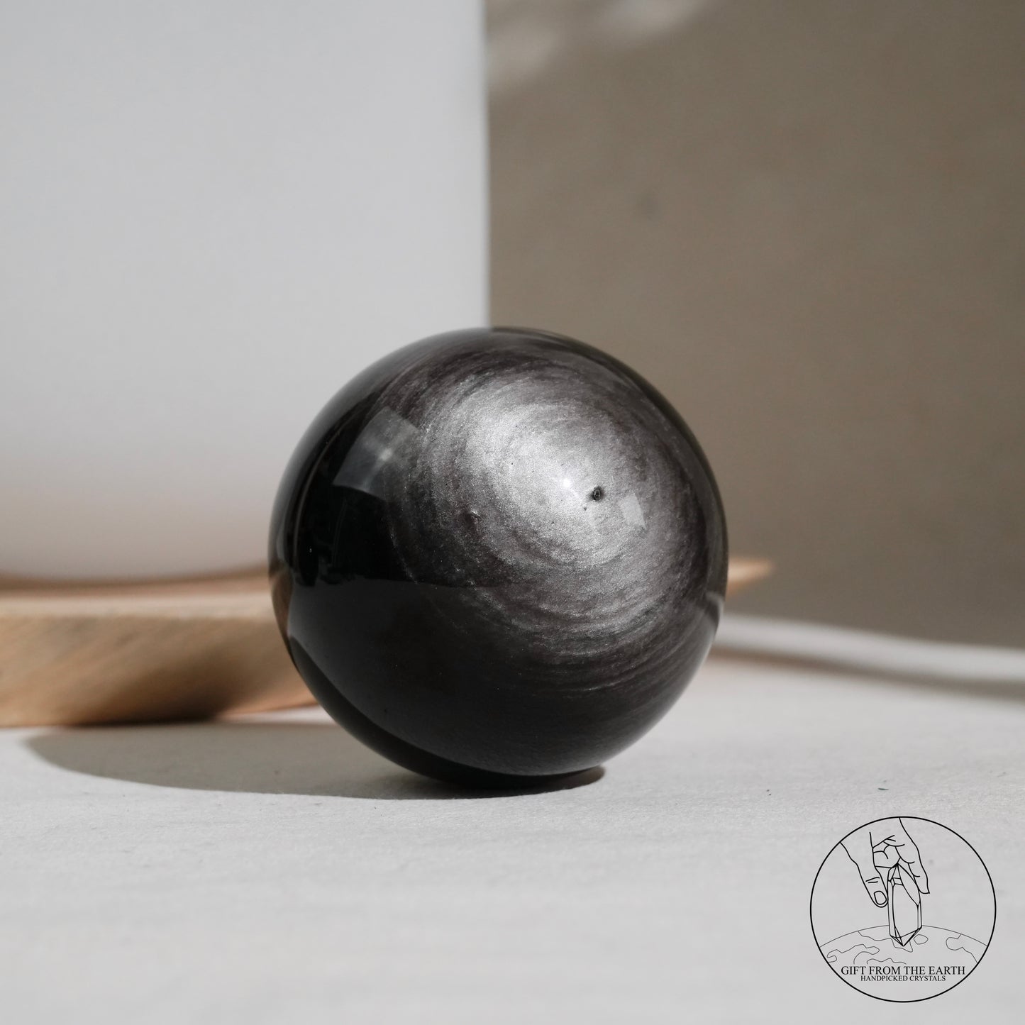 Silver sheen obsidian sphere
