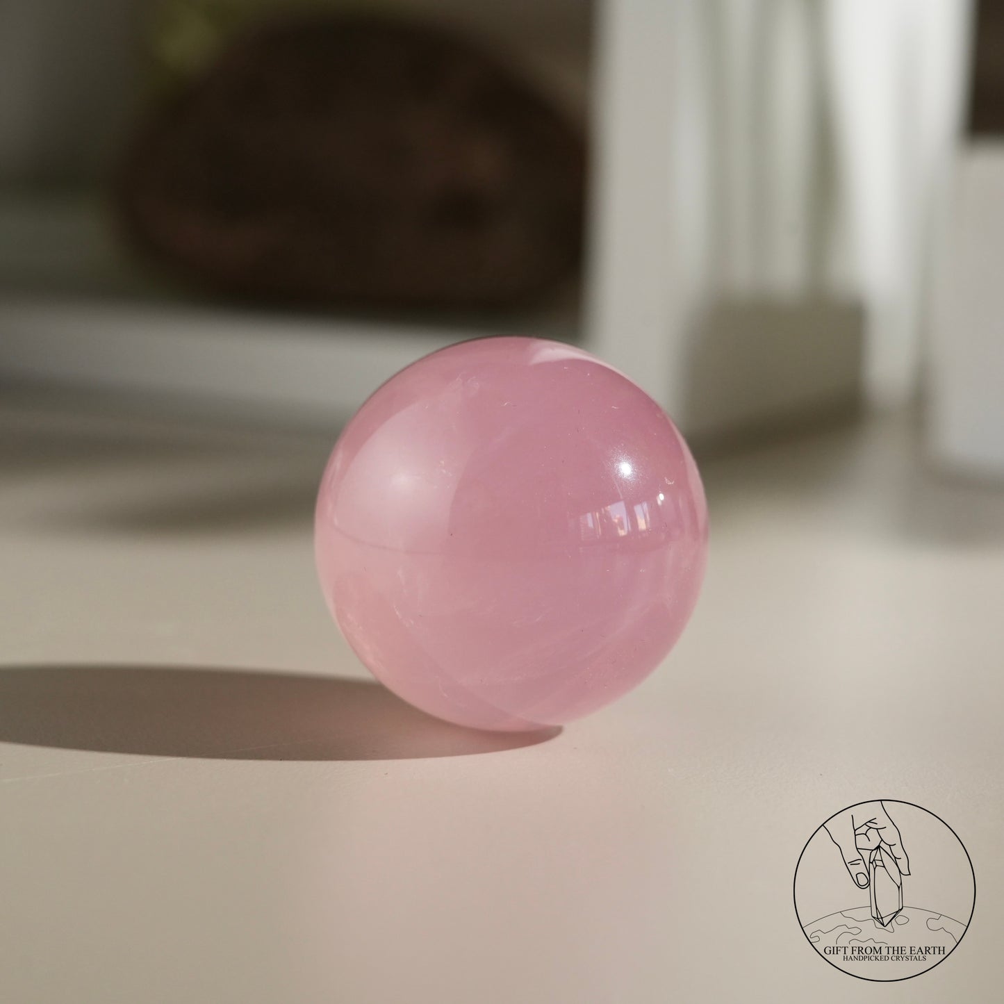 Mozambique starry rose quartz sphere