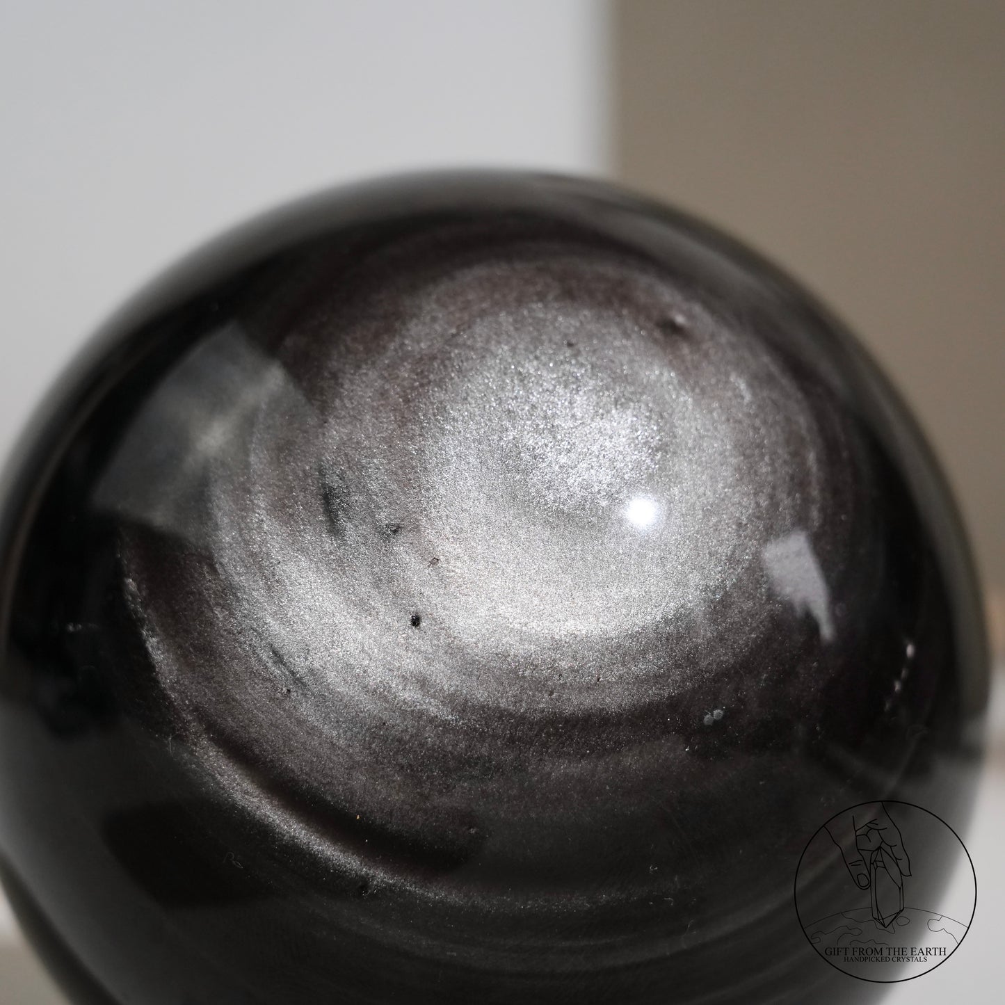 Silver sheen obsidian sphere