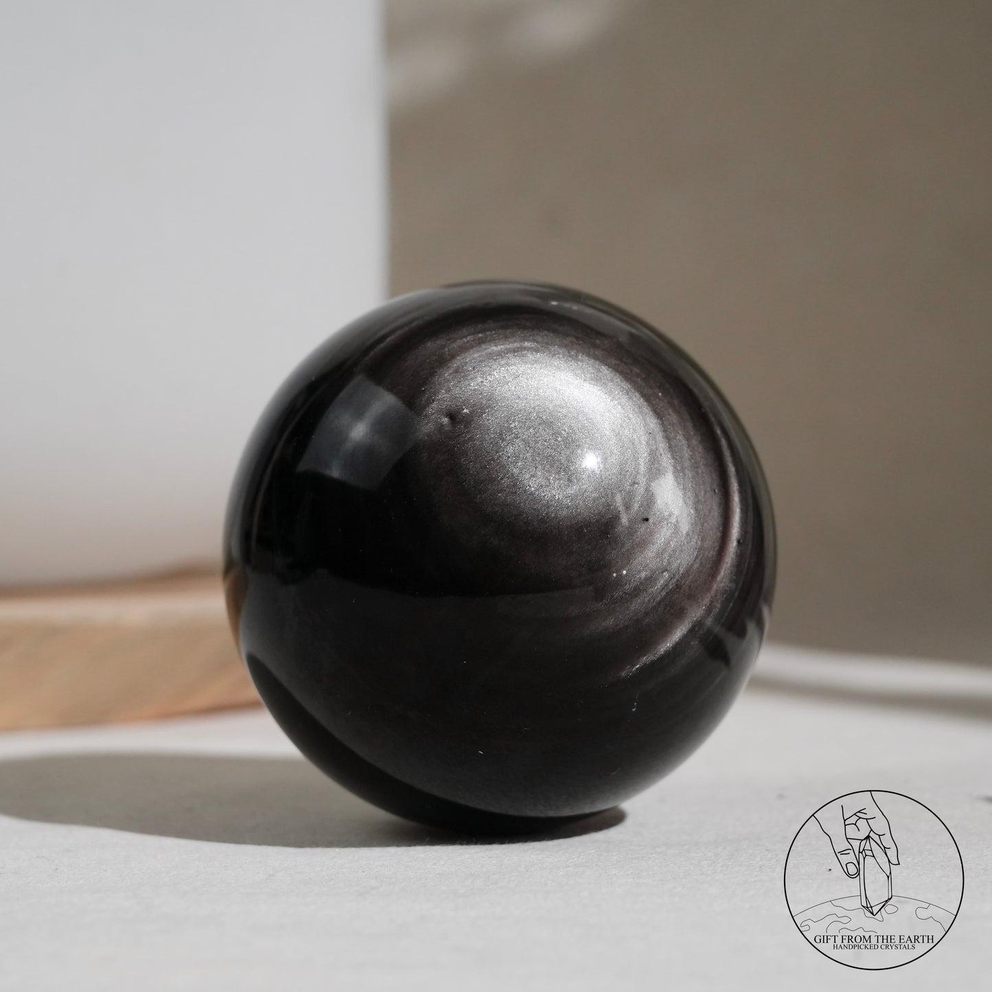 Silver sheen obsidian sphere