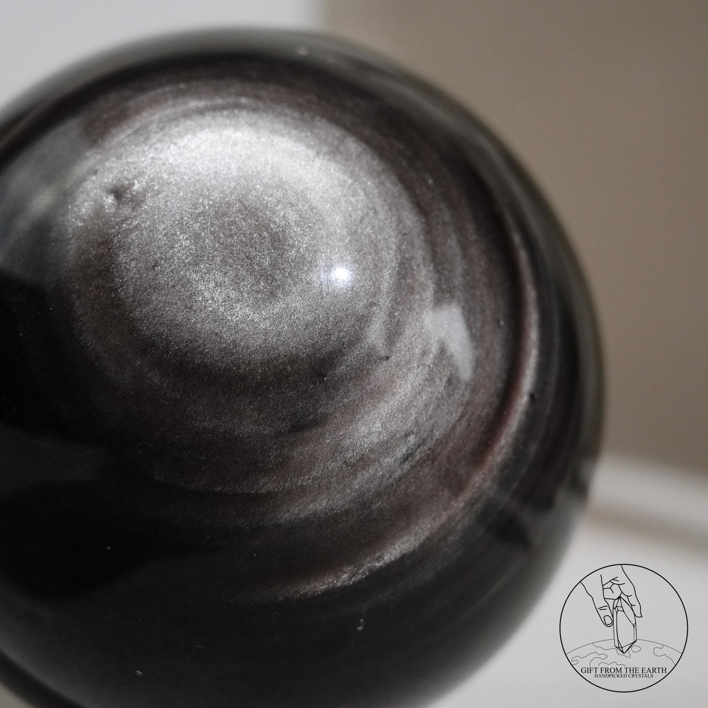 Silver sheen obsidian sphere