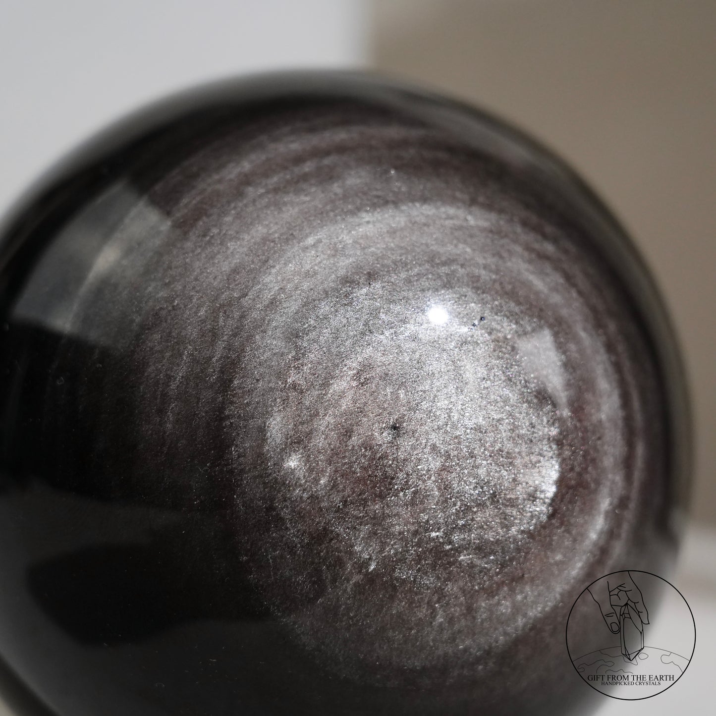 Silver sheen obsidian sphere