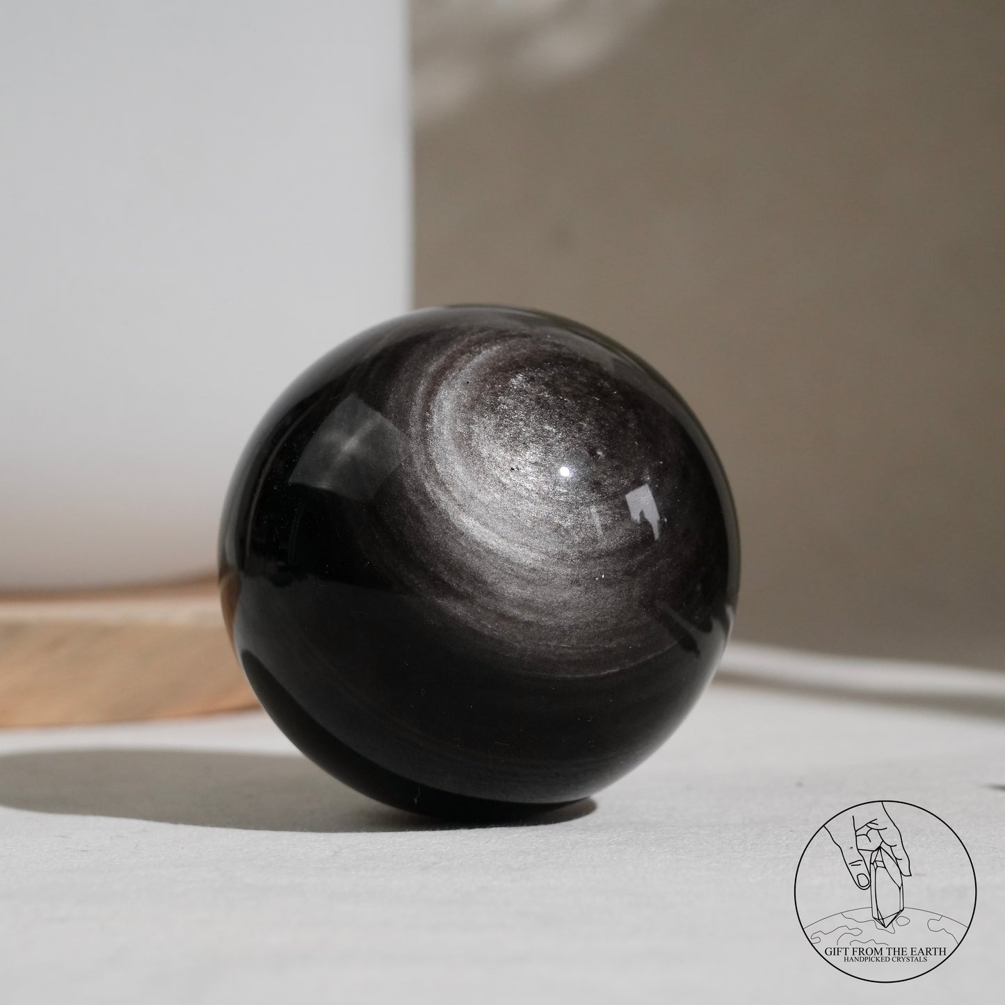 Silver sheen obsidian sphere
