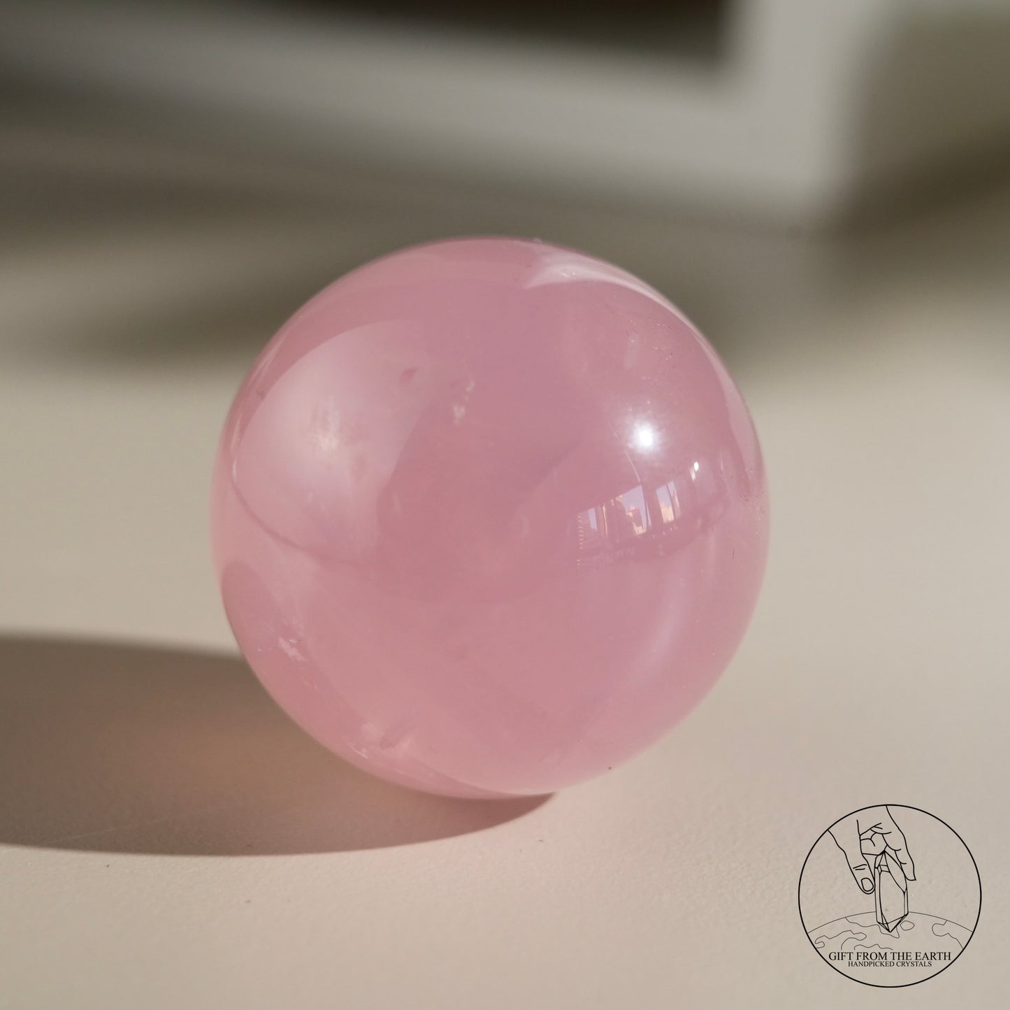 Mozambique starry rose quartz sphere