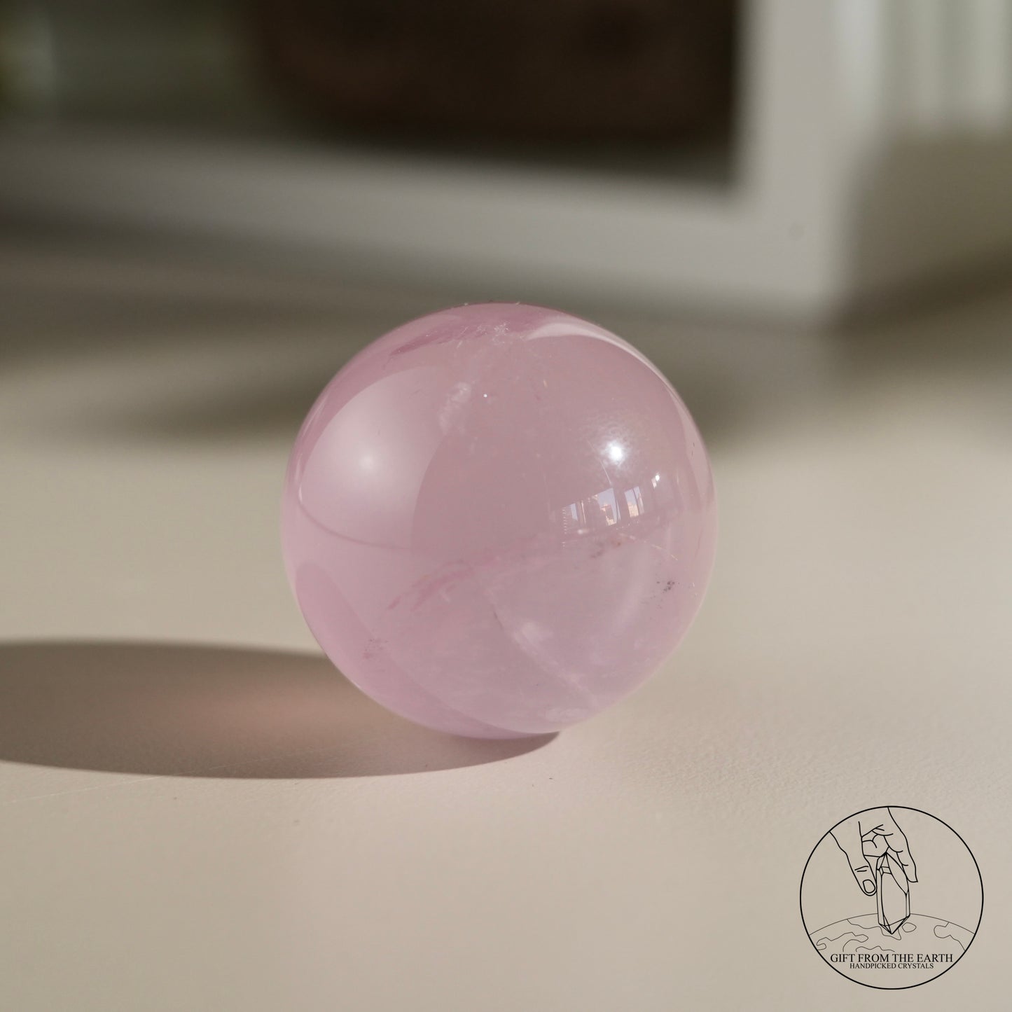 Mozambique starry rose quartz sphere