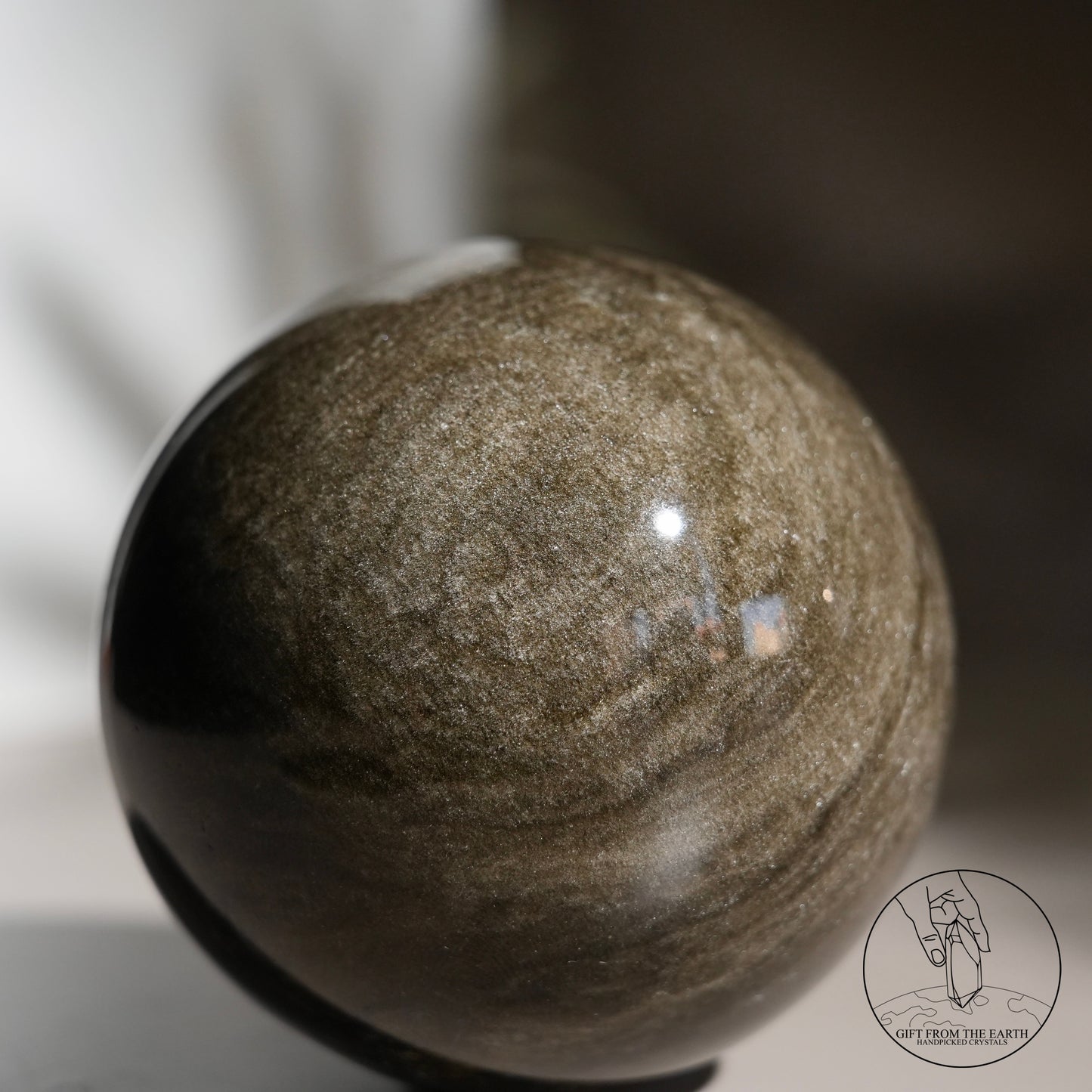 Golden obsidian sphere