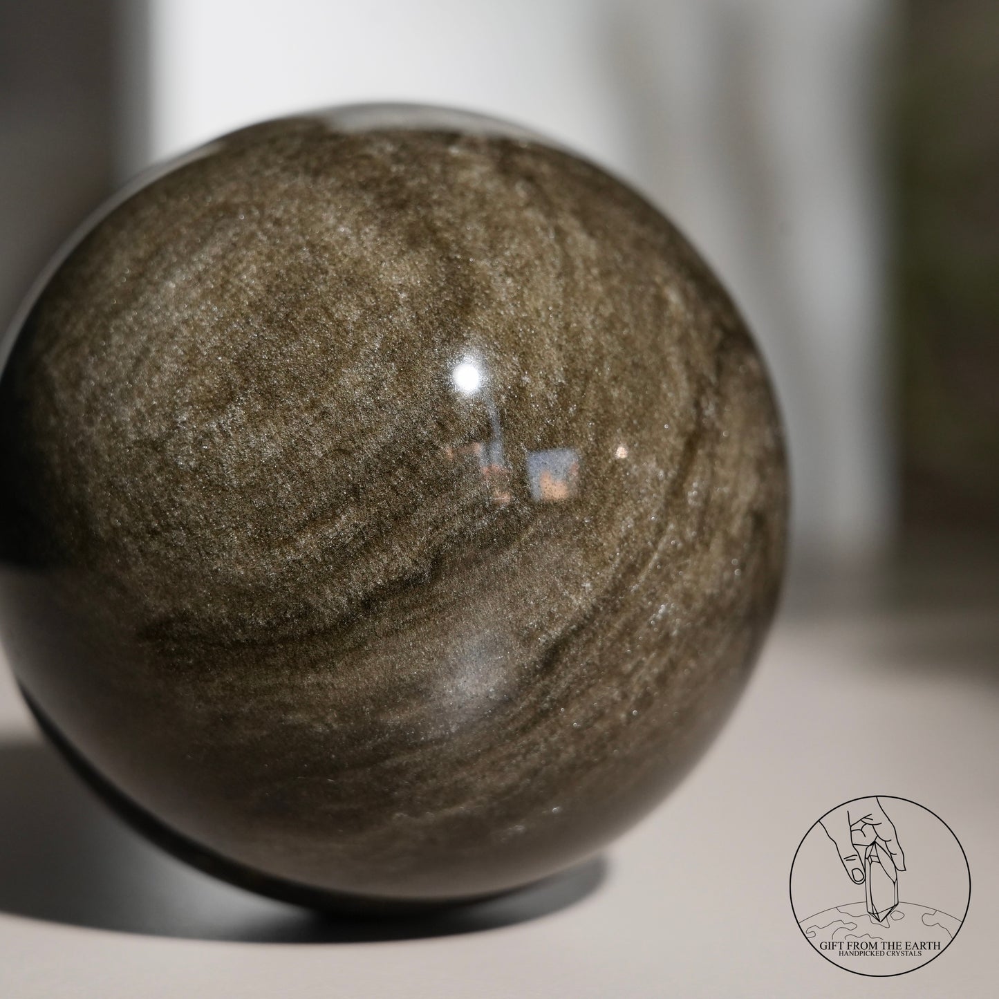 Golden obsidian sphere