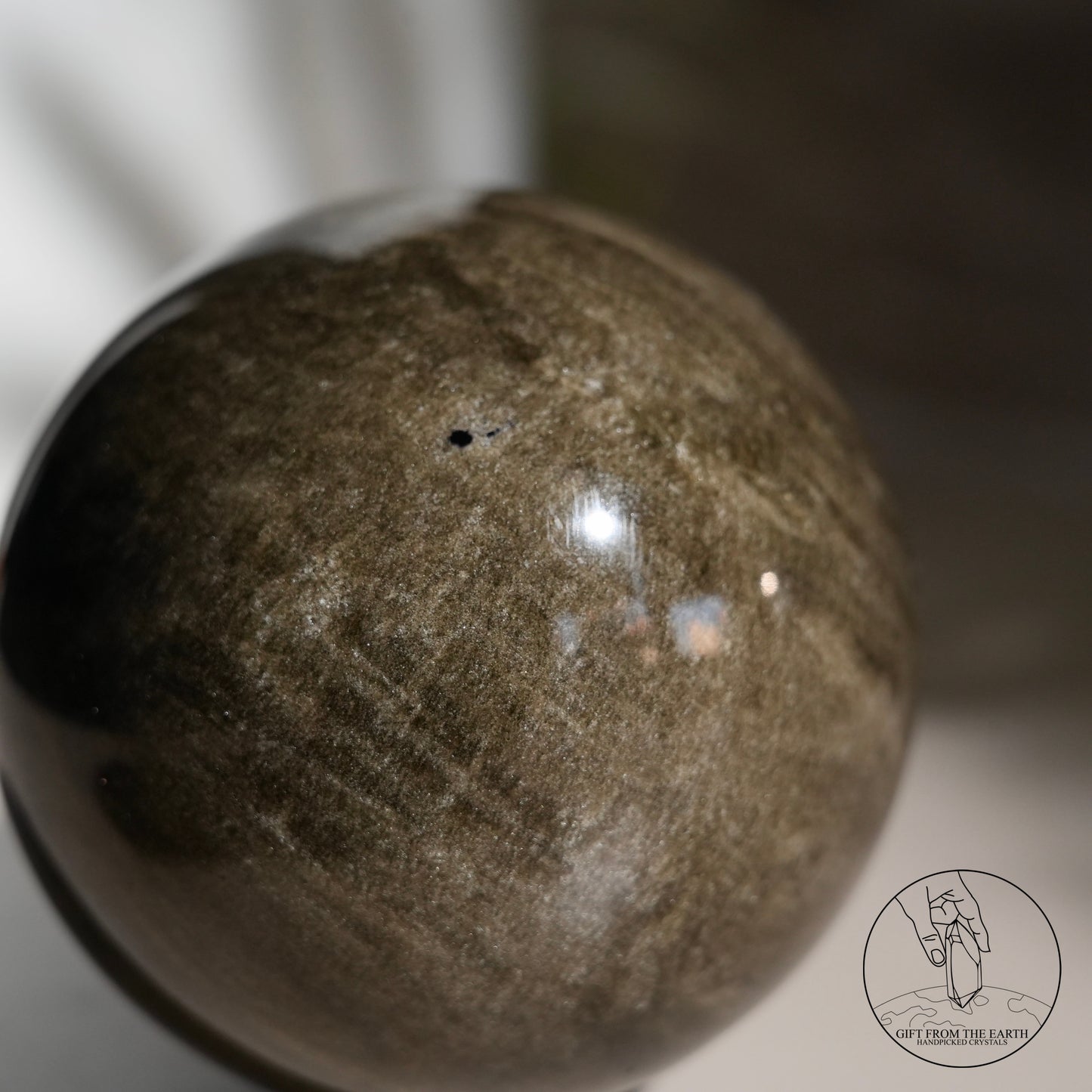 Golden obsidian sphere