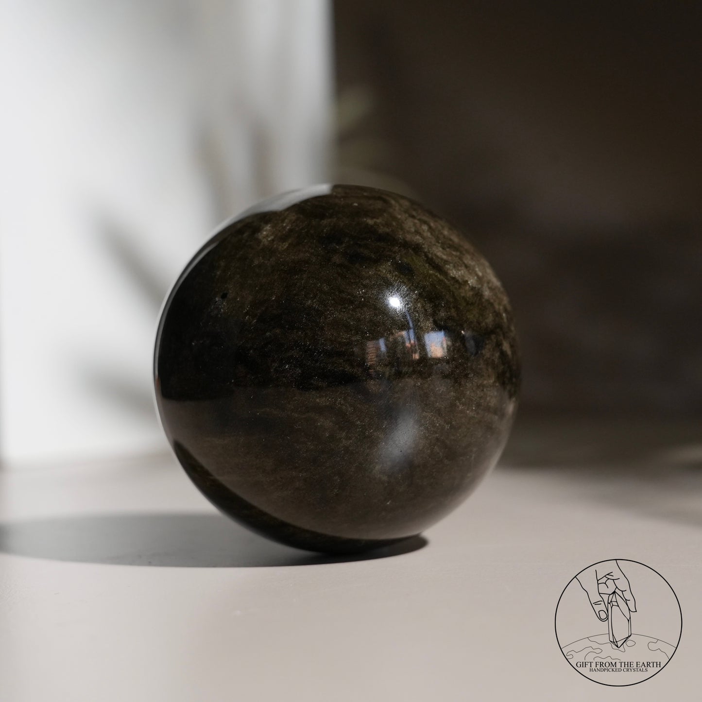 Golden obsidian sphere