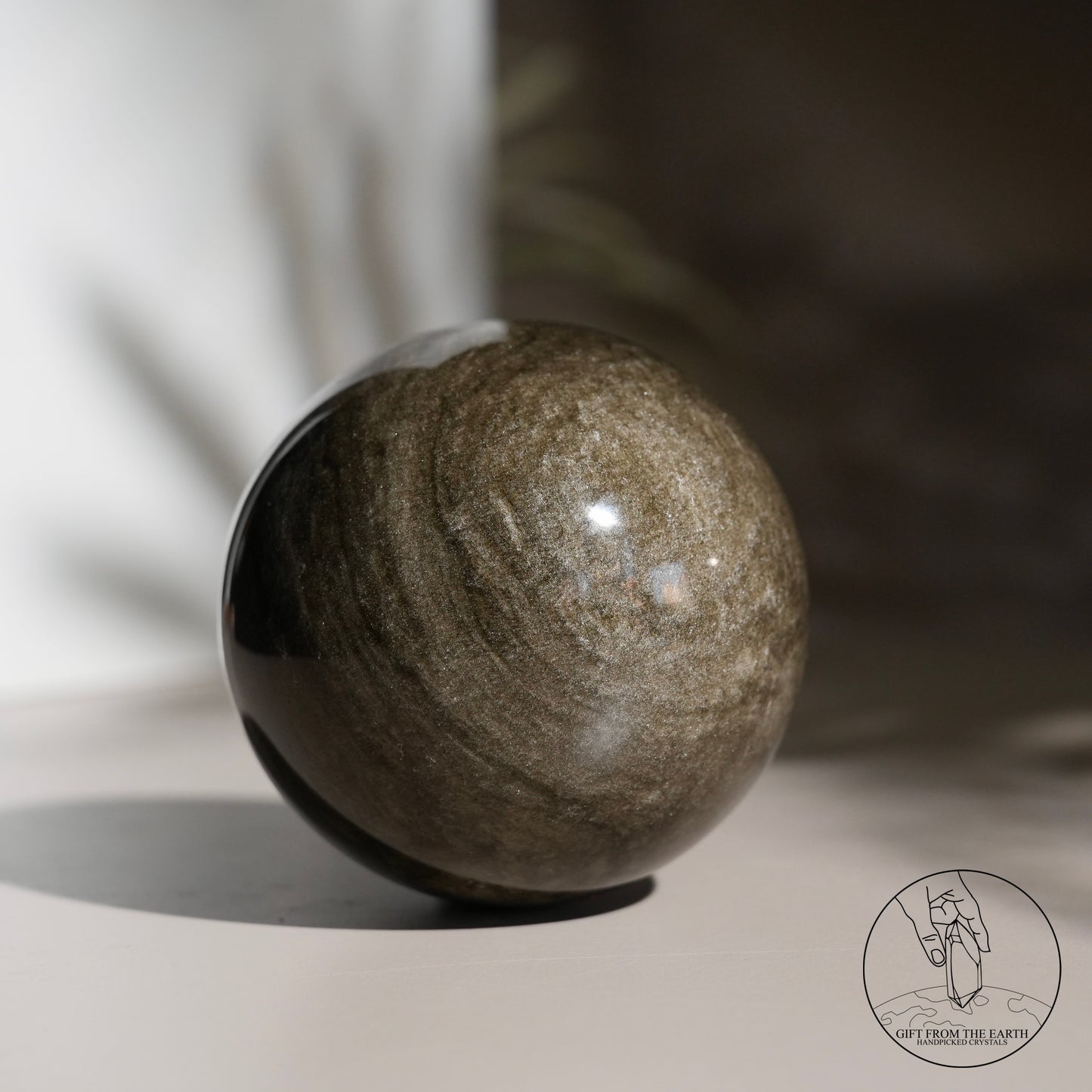 Golden obsidian sphere