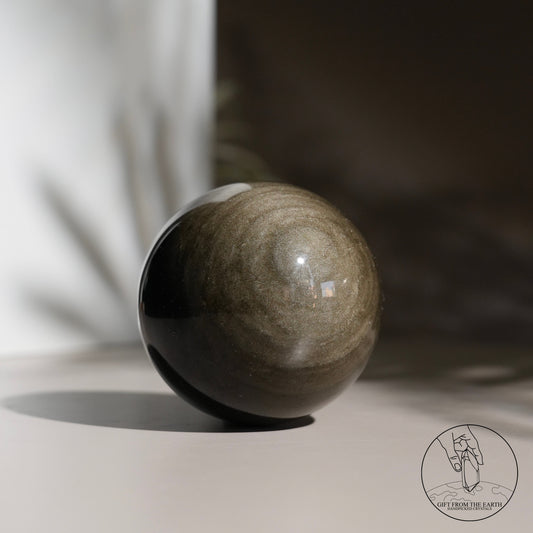 Golden obsidian sphere