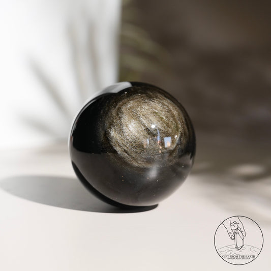 Golden obsidian sphere