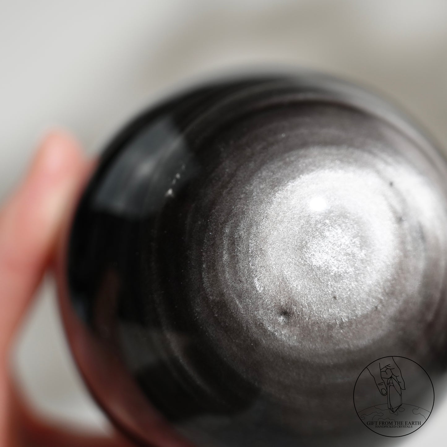 Silver sheen obsidian sphere
