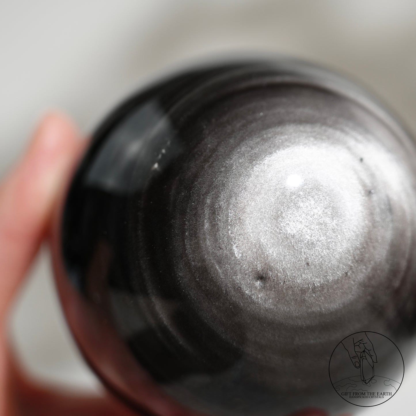 Silver sheen obsidian sphere