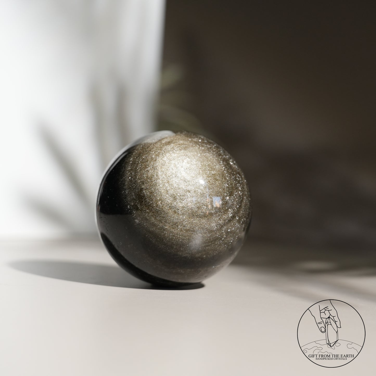 Golden obsidian sphere