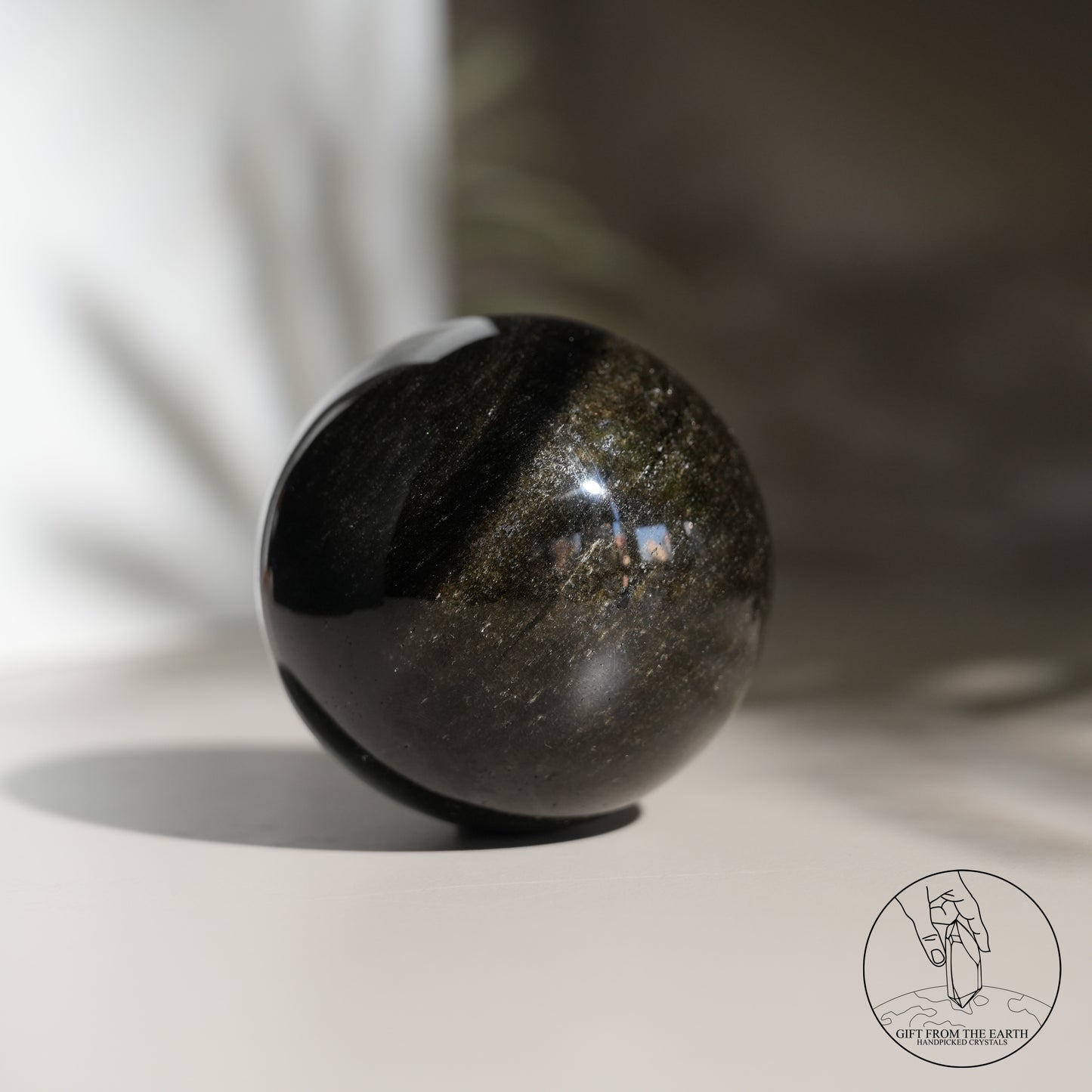 Golden obsidian sphere