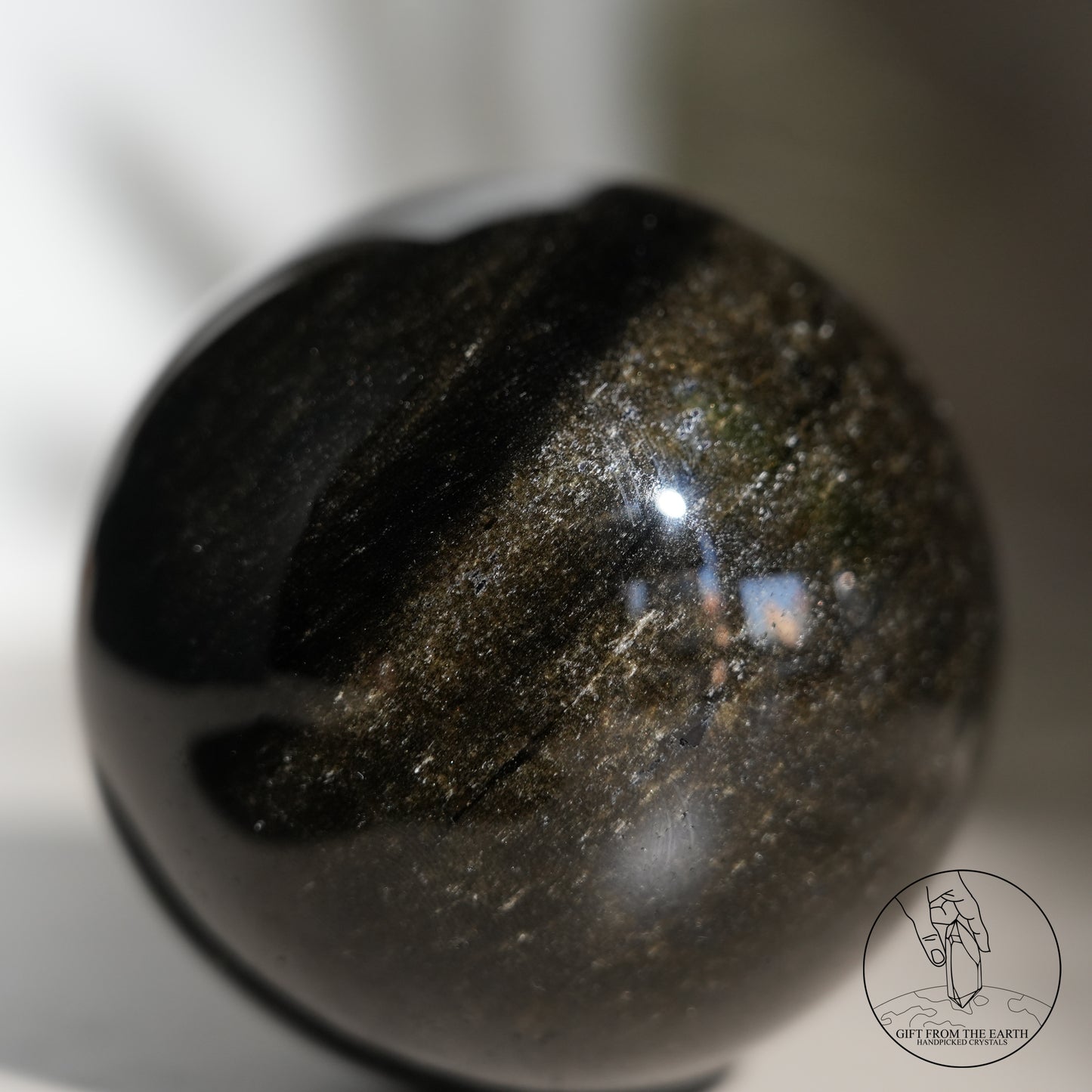 Golden obsidian sphere