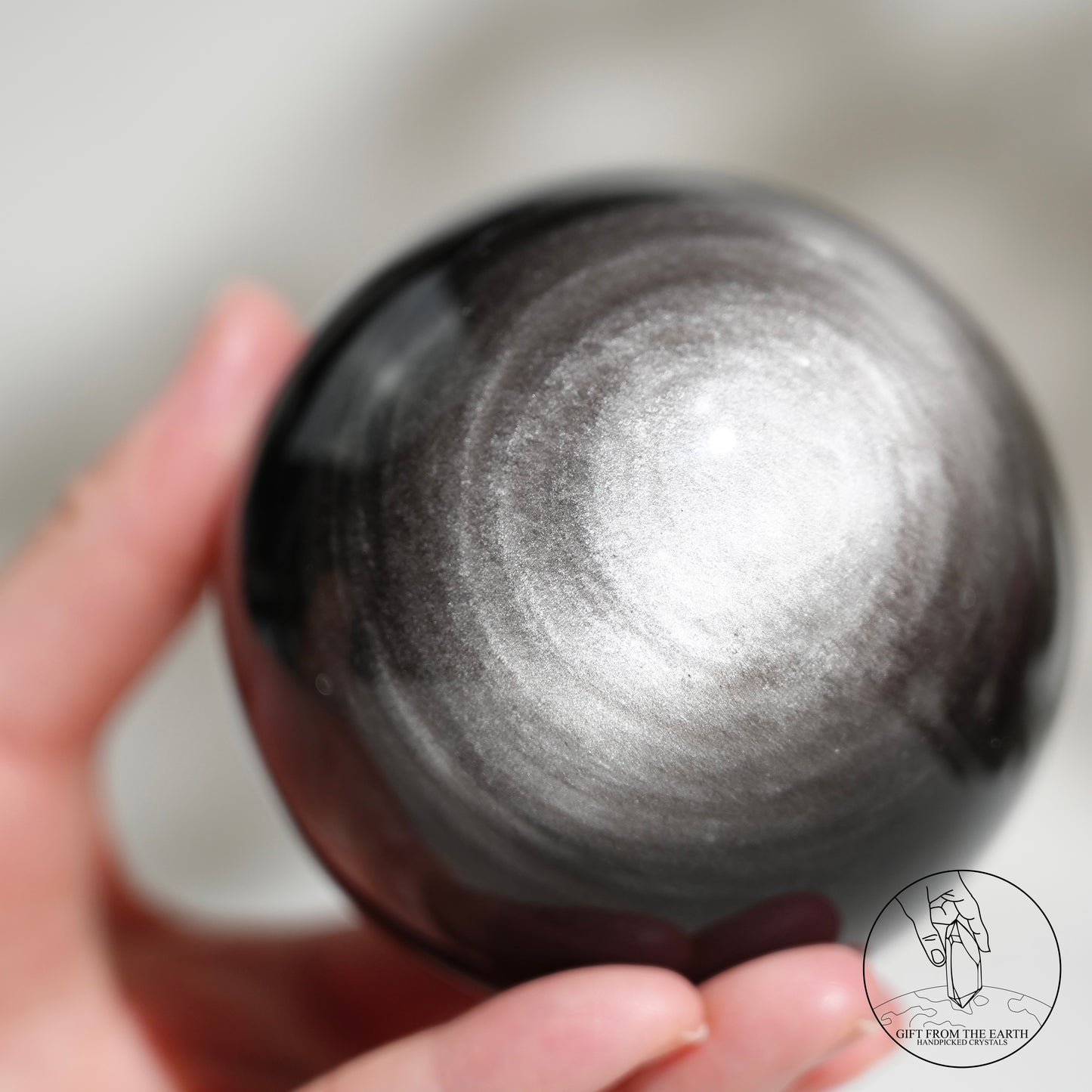 Silver sheen obsidian sphere
