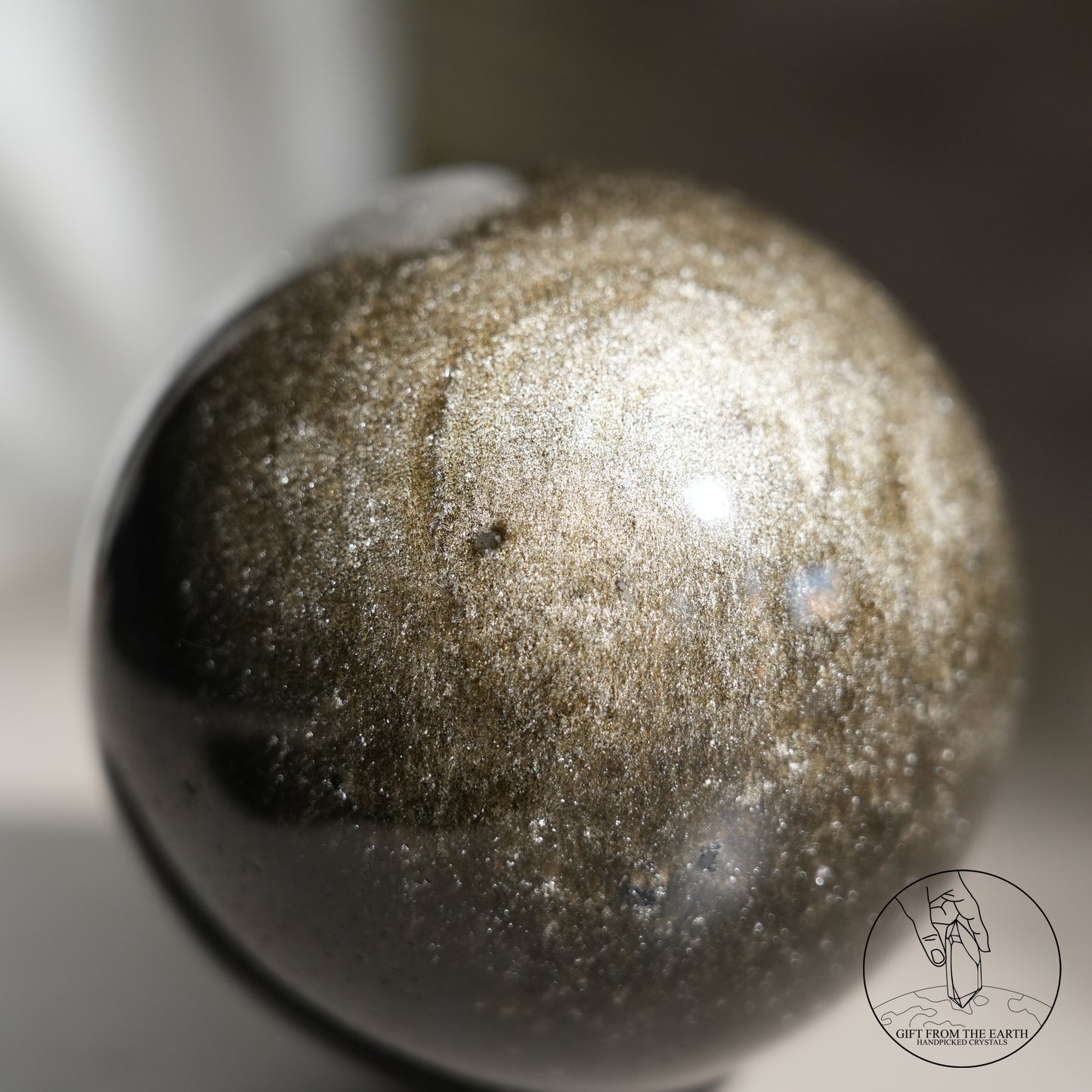 Golden obsidian sphere