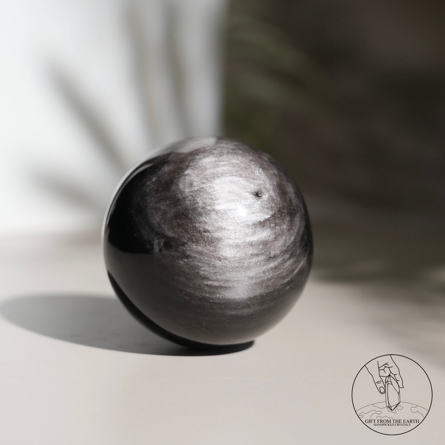 Silver sheen obsidian sphere