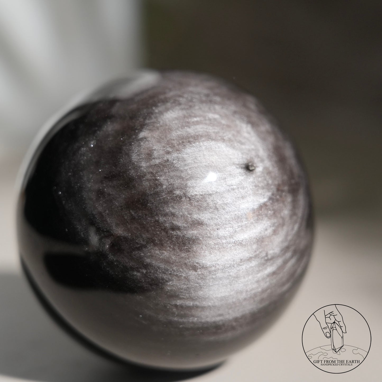 Silver sheen obsidian sphere