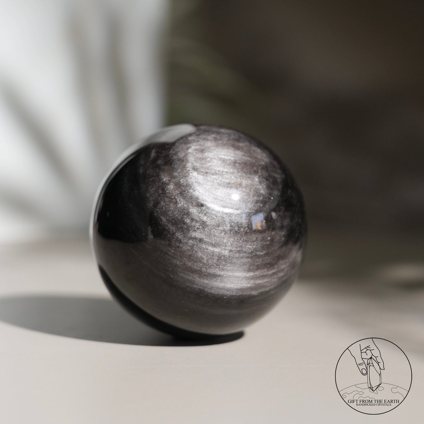 Silver sheen obsidian sphere