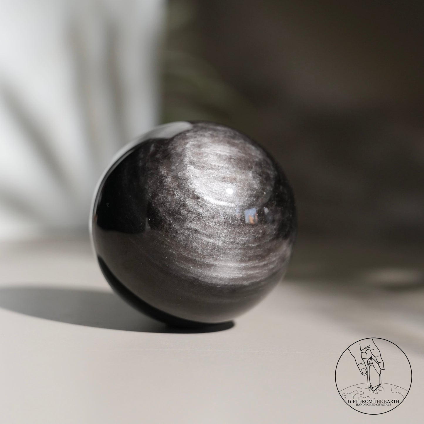 Silver sheen obsidian sphere