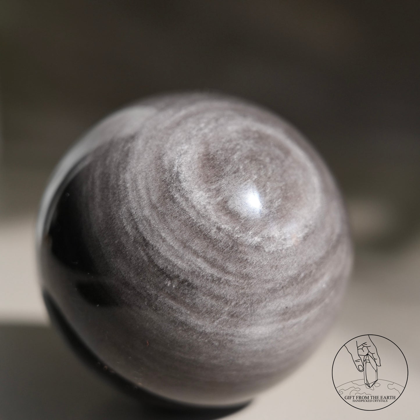 Silver sheen obsidian sphere