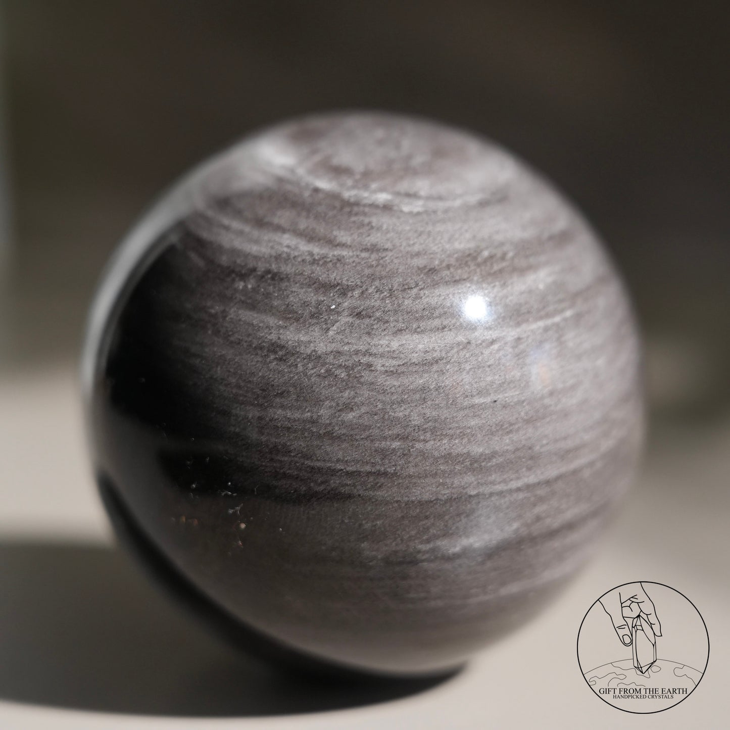 Silver sheen obsidian sphere