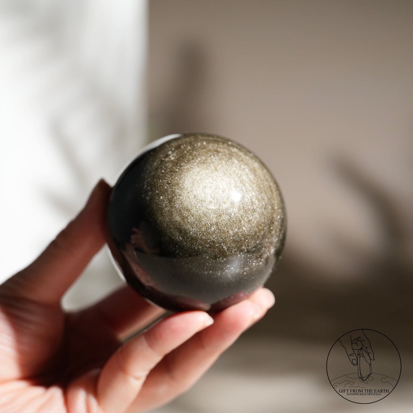 Golden obsidian sphere