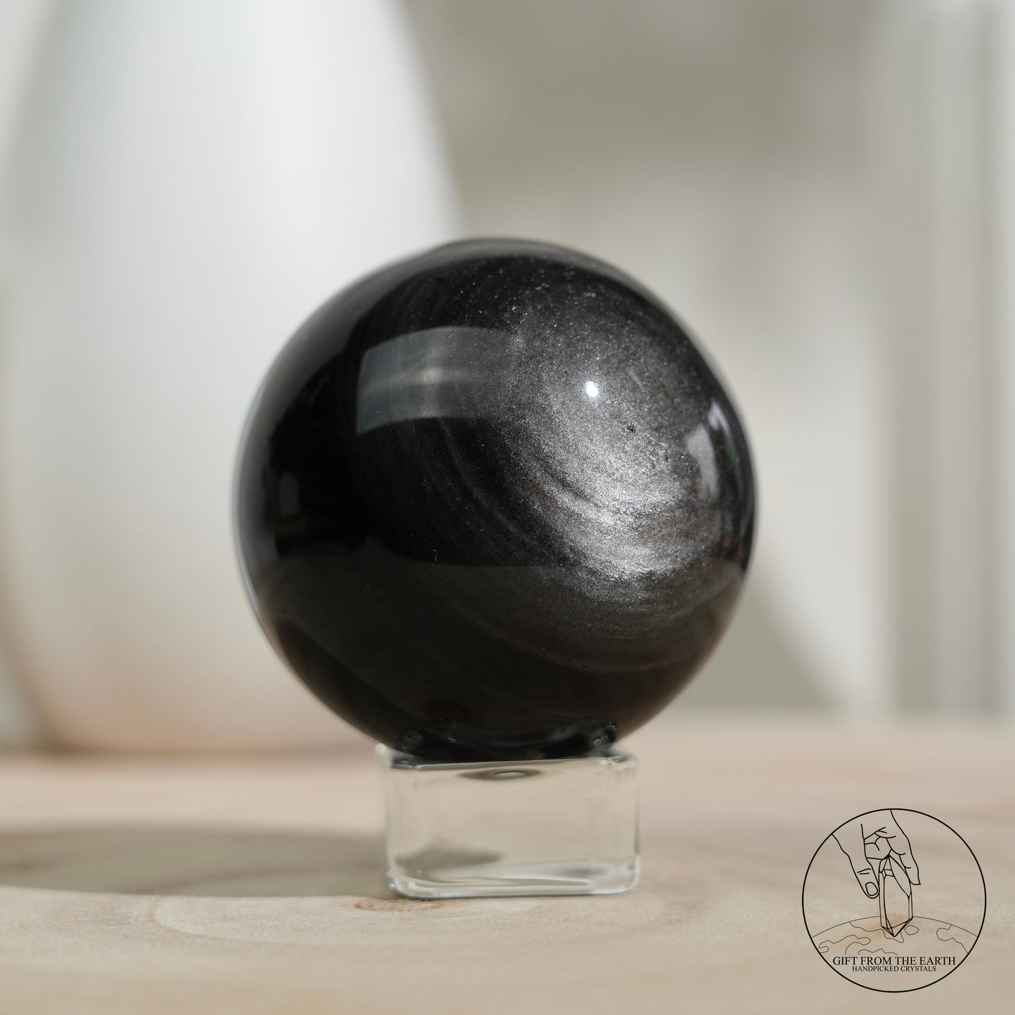 Silver sheen obsidian sphere