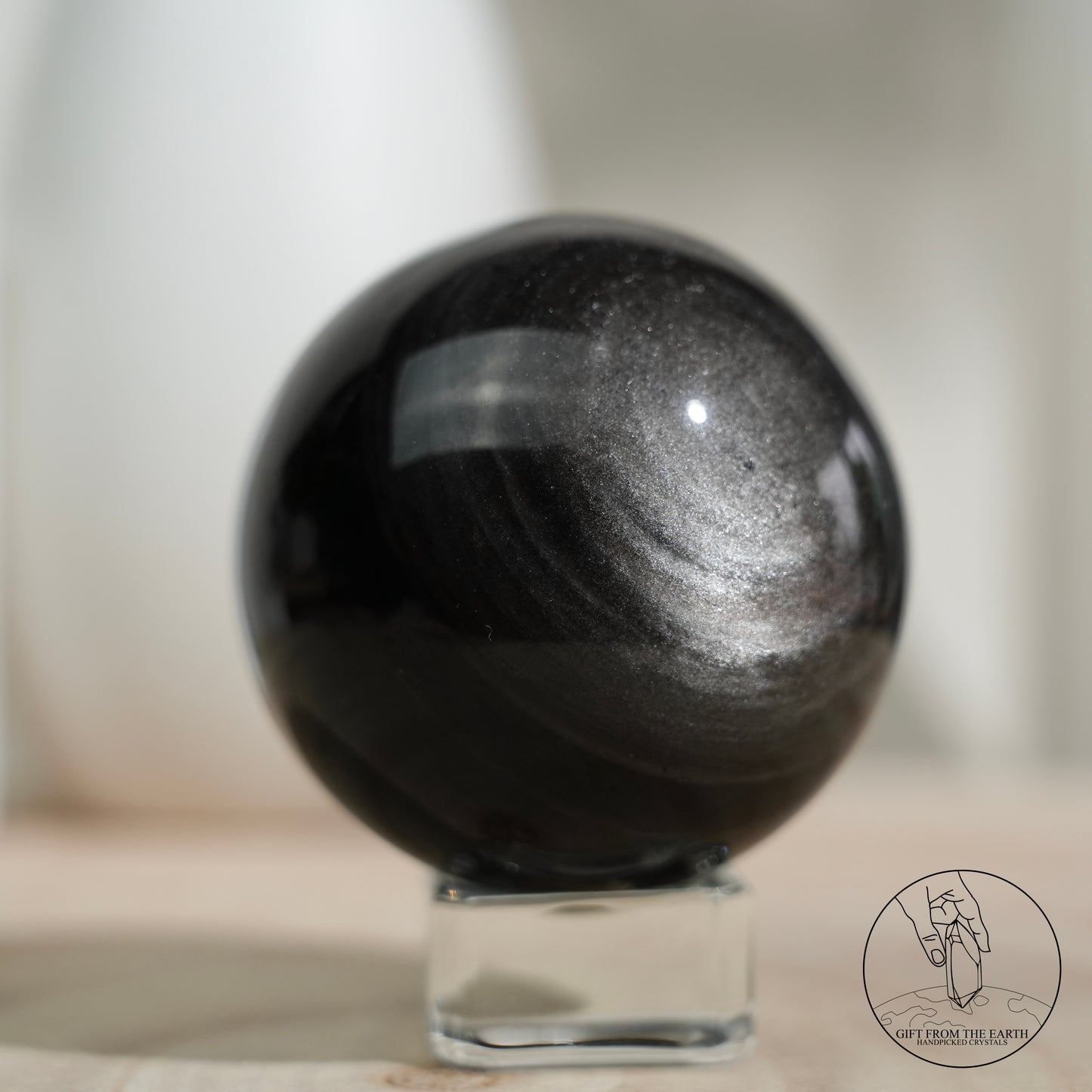 Silver sheen obsidian sphere