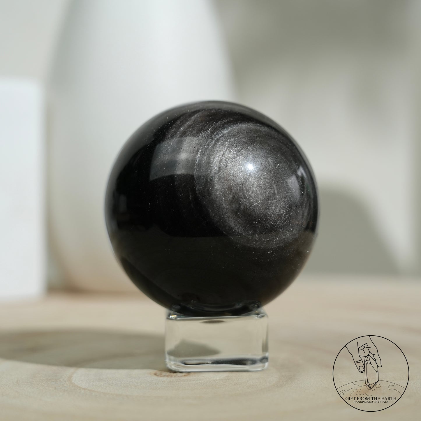 Silver sheen obsidian sphere