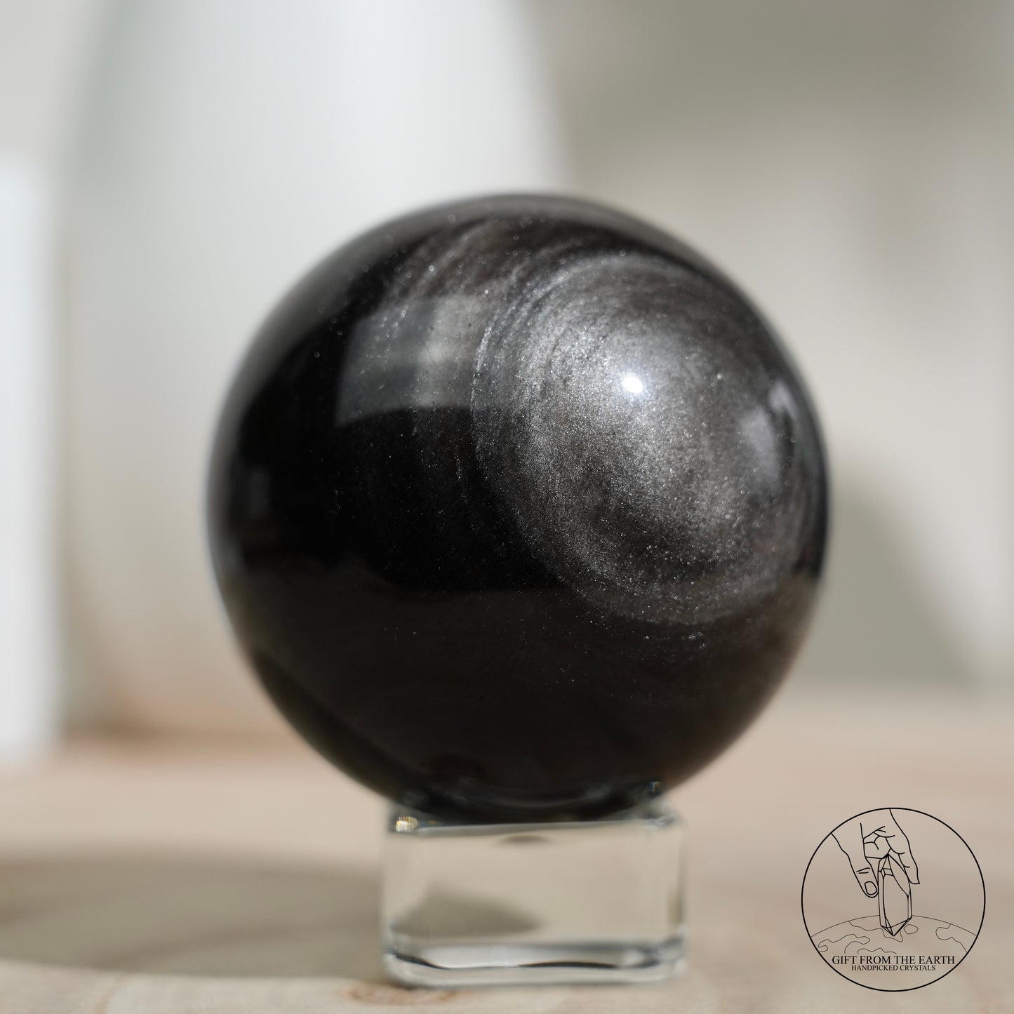 Silver sheen obsidian sphere