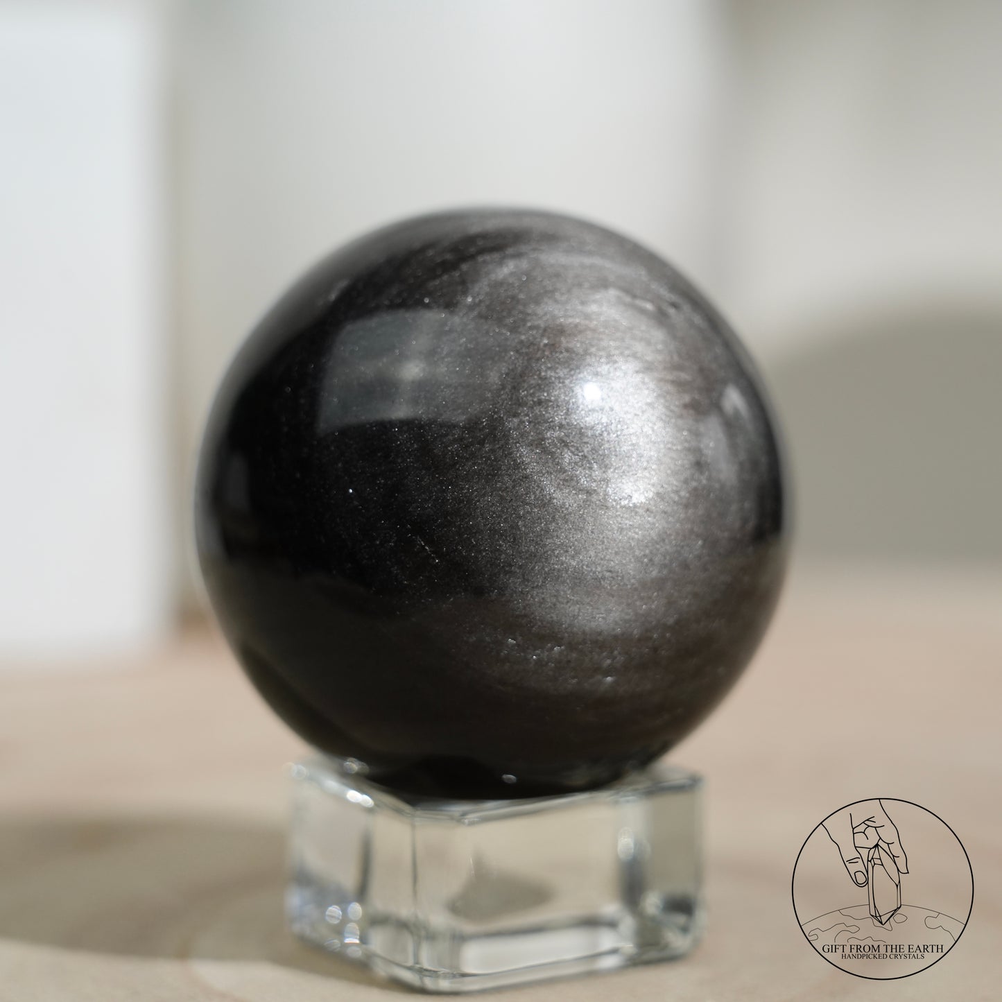 Silver sheen obsidian sphere