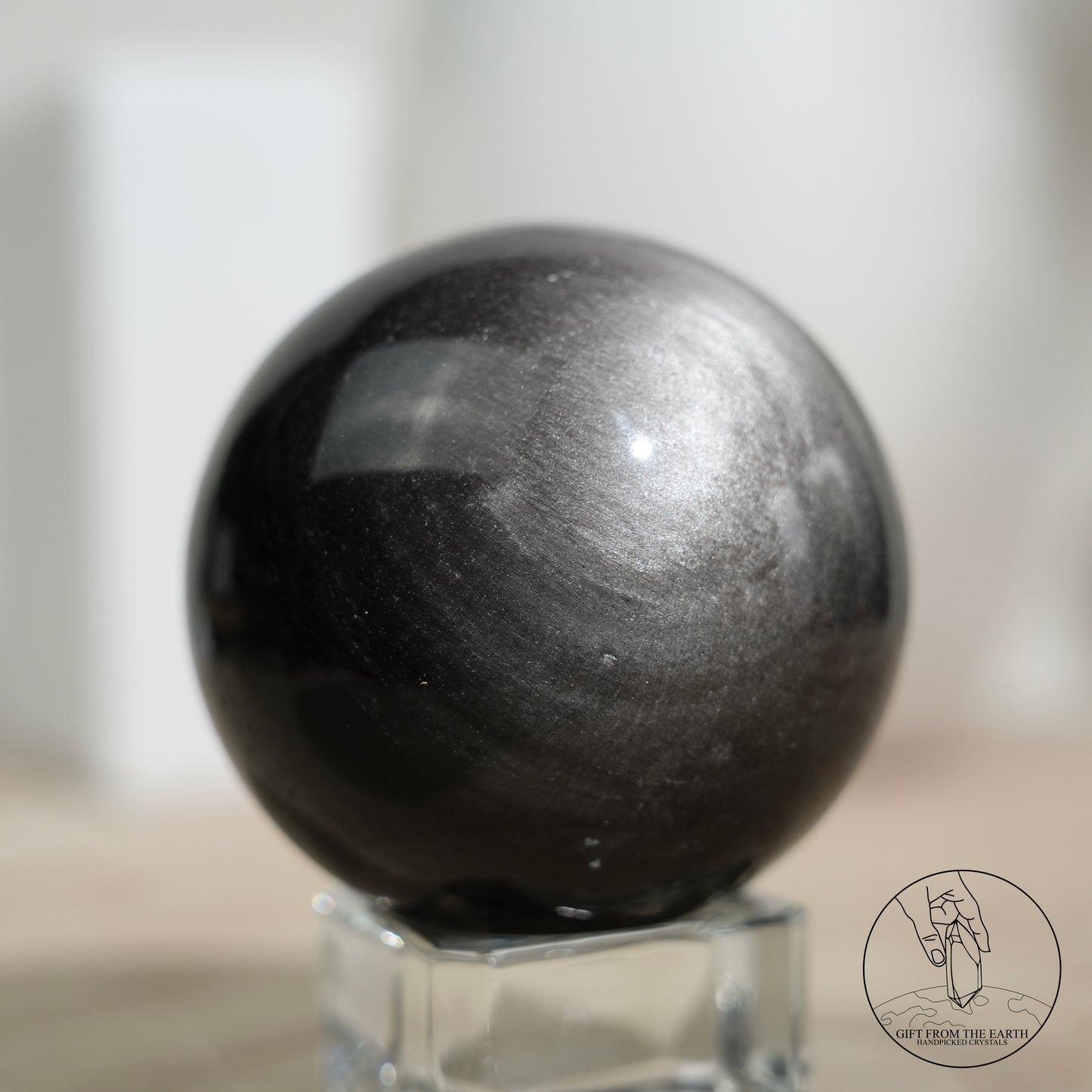 Silver sheen obsidian sphere