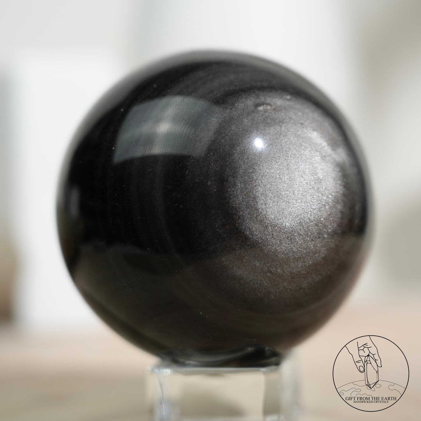 Silver sheen obsidian sphere
