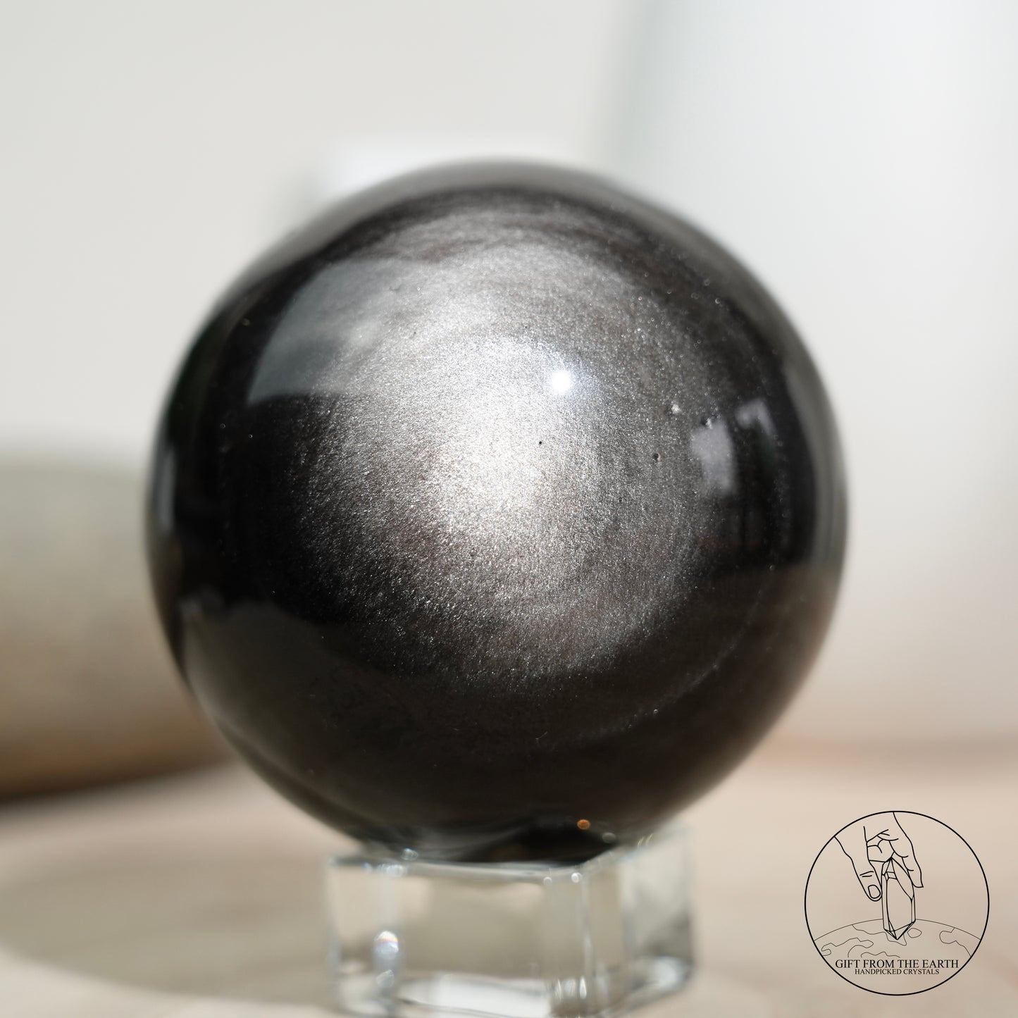 Silver sheen obsidian sphere