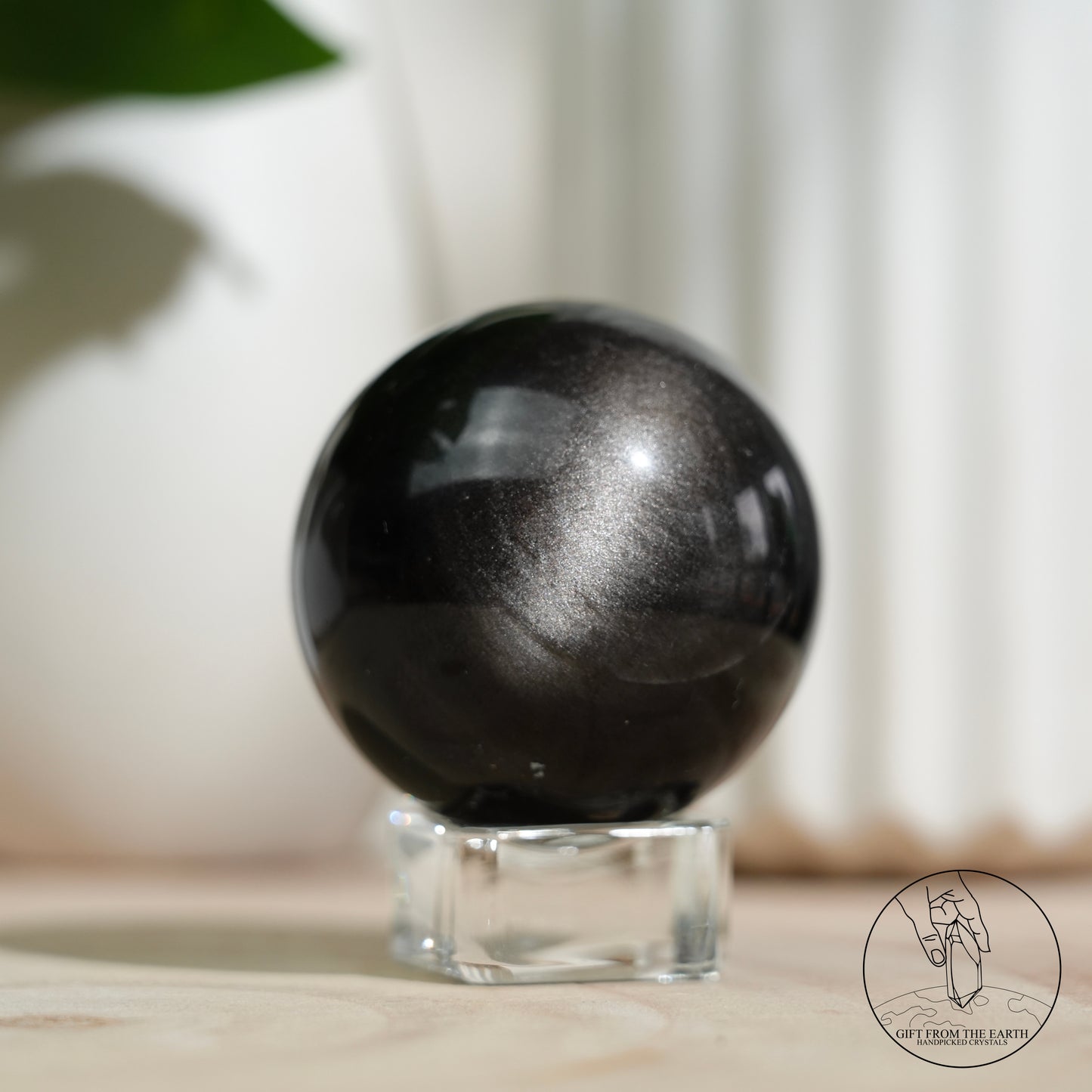 Silver sheen obsidian sphere