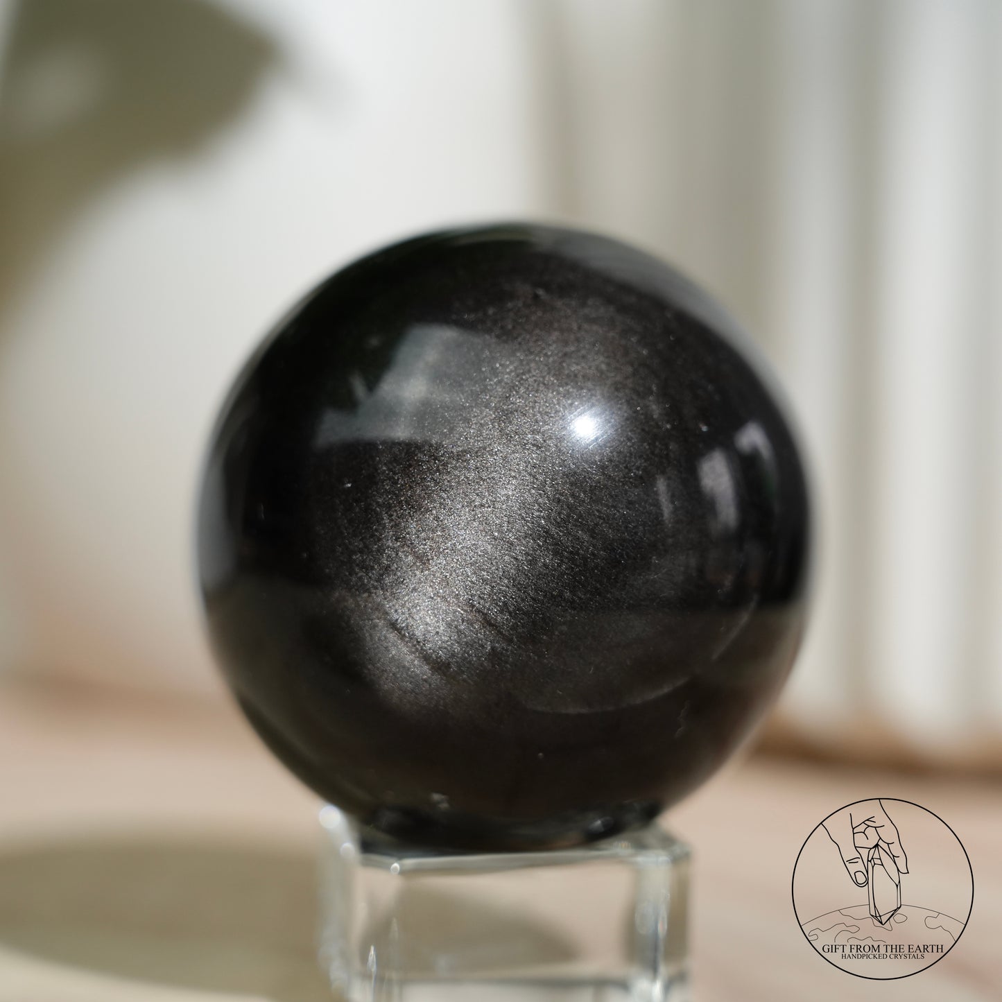 Silver sheen obsidian sphere