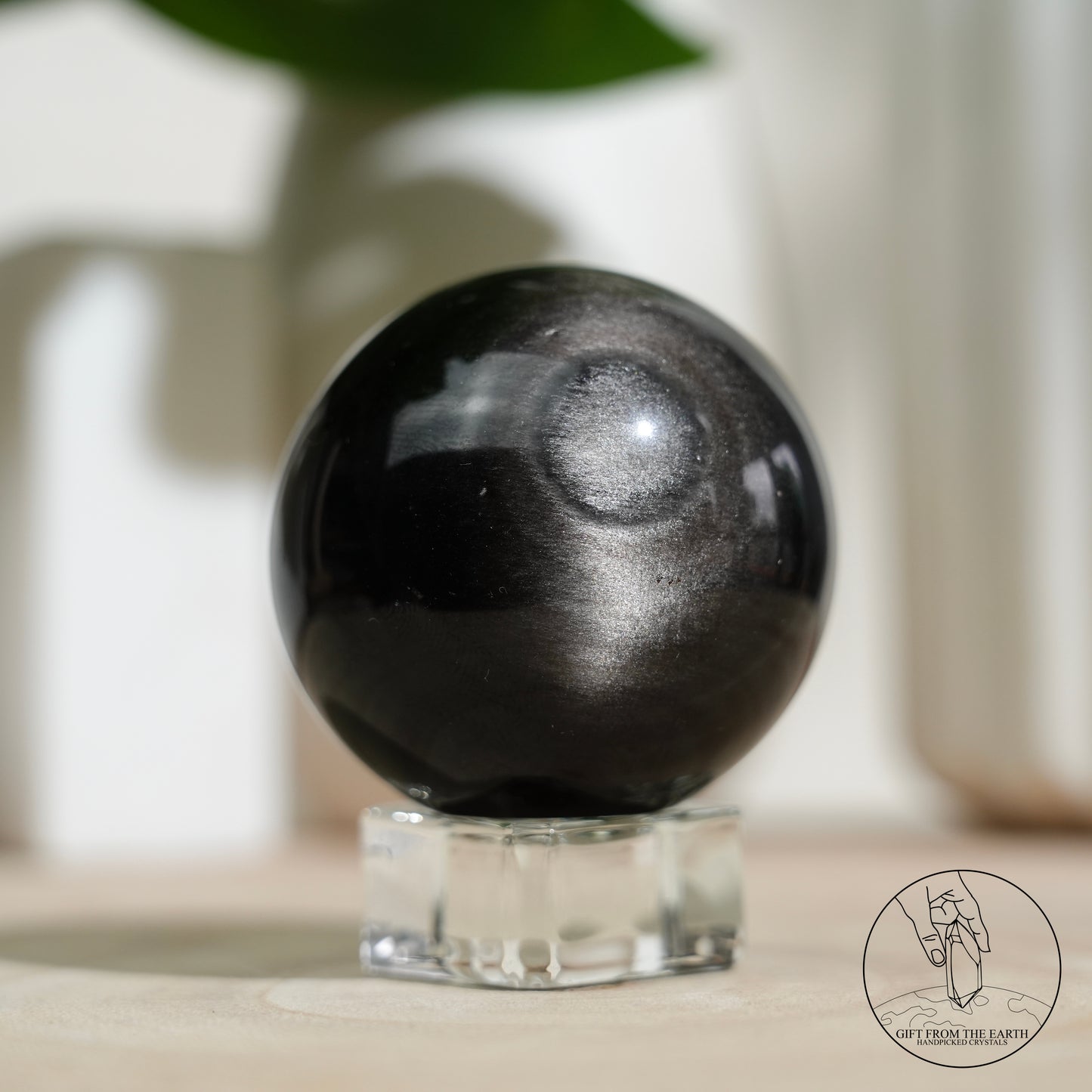 Silver sheen obsidian sphere