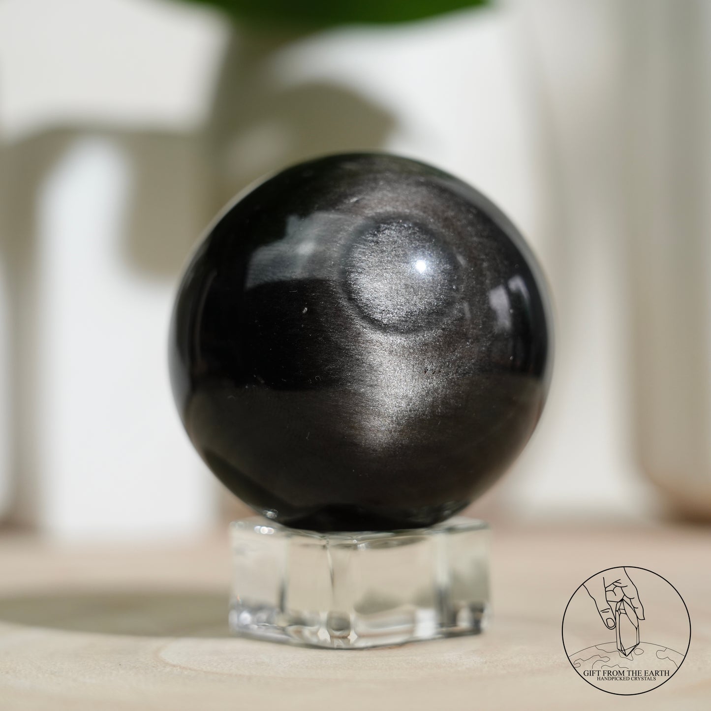 Silver sheen obsidian sphere