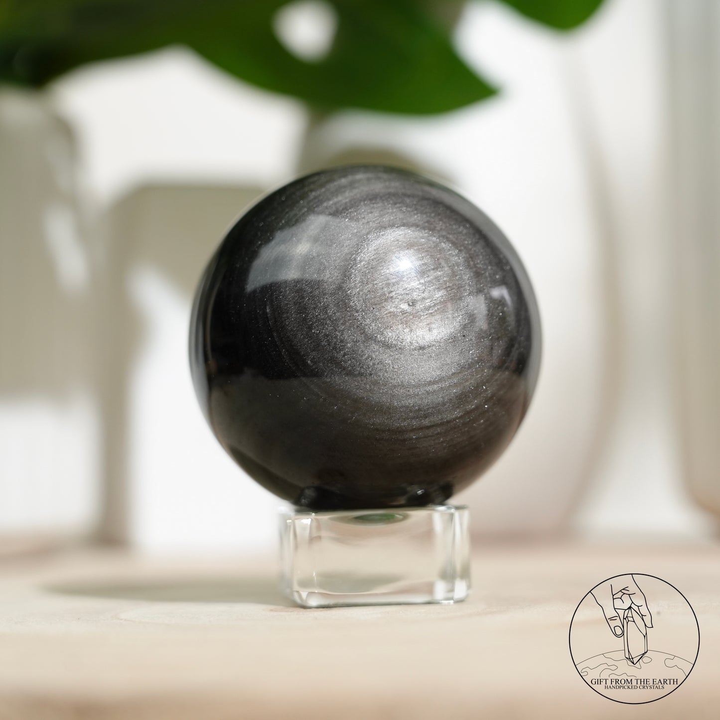Silver sheen obsidian sphere