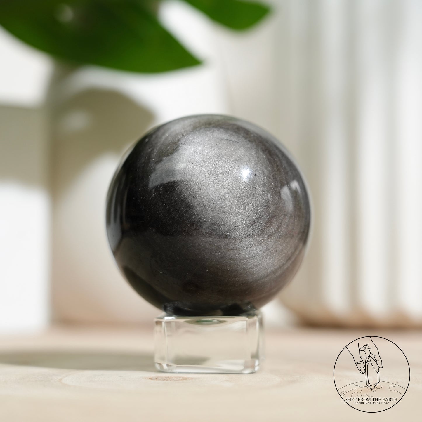 Silver sheen obsidian sphere