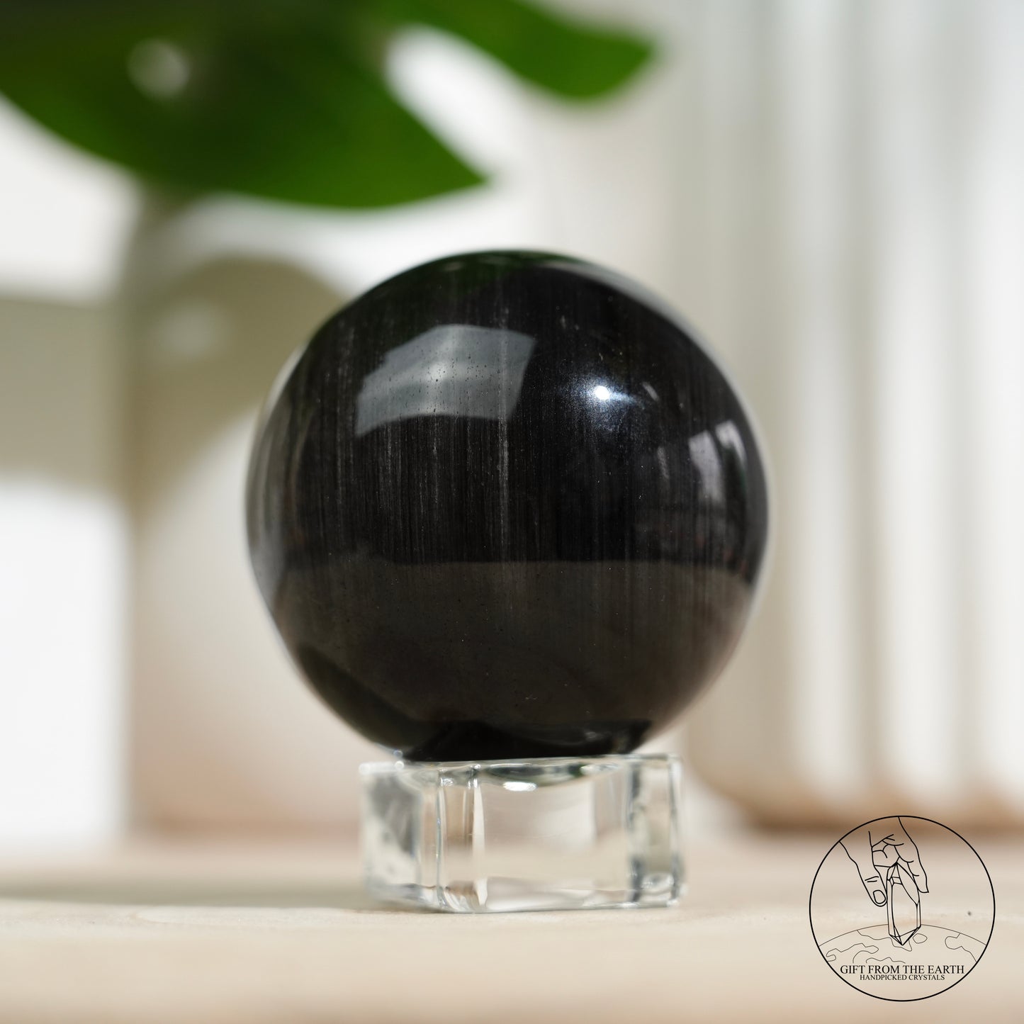 Silver sheen obsidian sphere