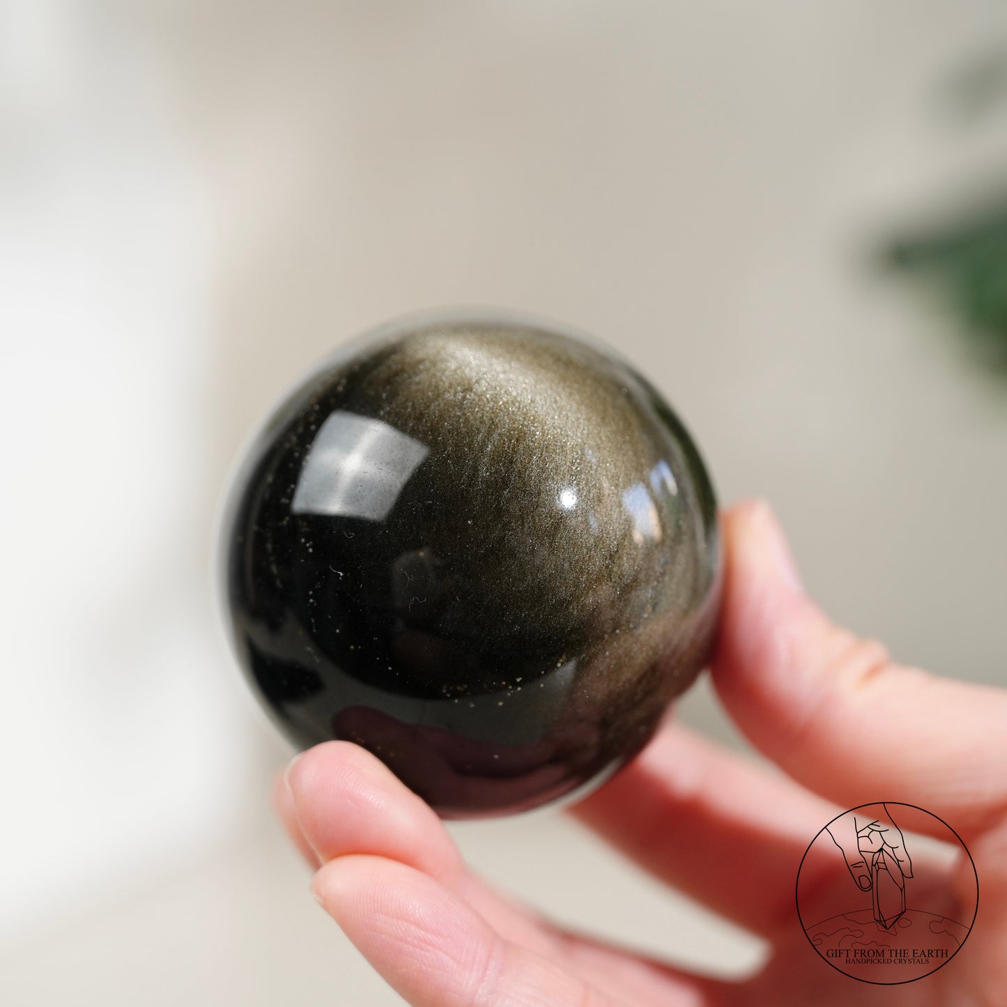 Golden obsidian sphere