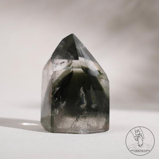 Half-polished multi-layered red-green phantom quartz point